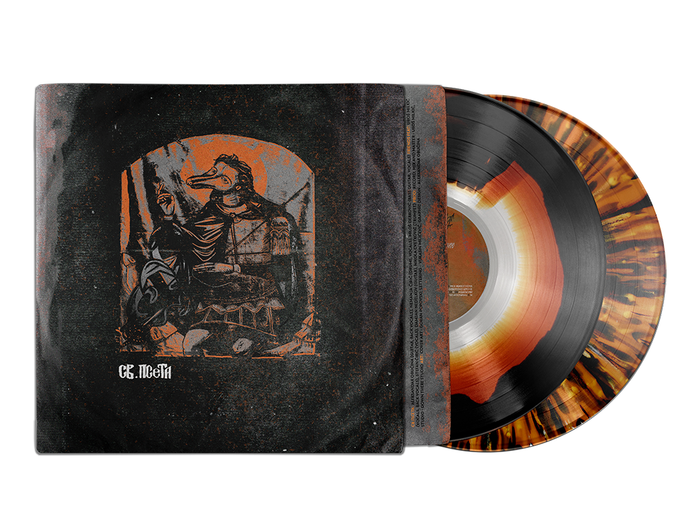 A vinyl record with a splattered fiery orange and black design is partially pulled out of a sleeve with dark artwork featuring a figure with a bird-like mask and a horse, and some text in Cyrillic.