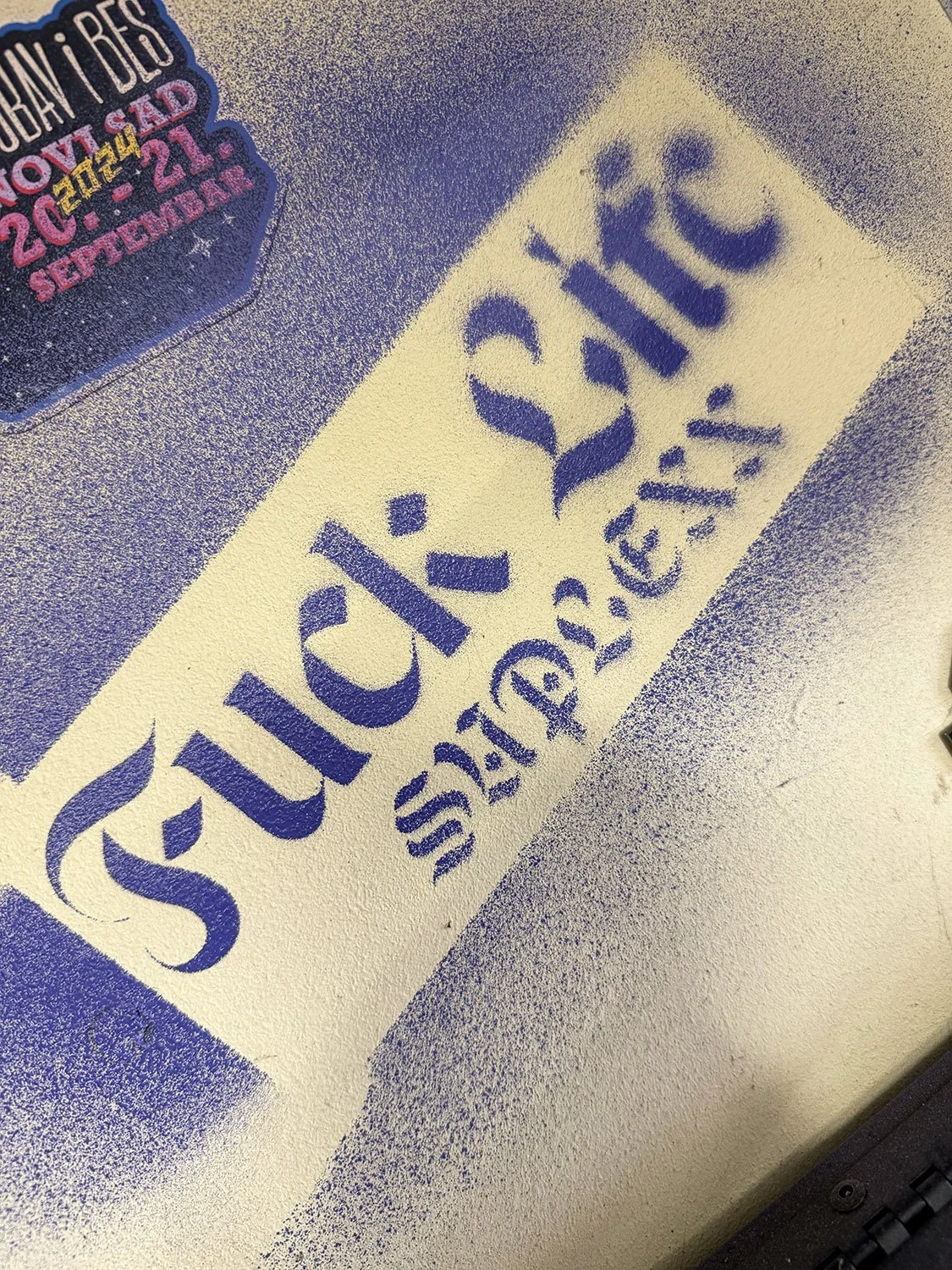 Stencil spray paint art displaying the words "FUCK" and "LIFE" with a stylized heart symbol. Suplexx