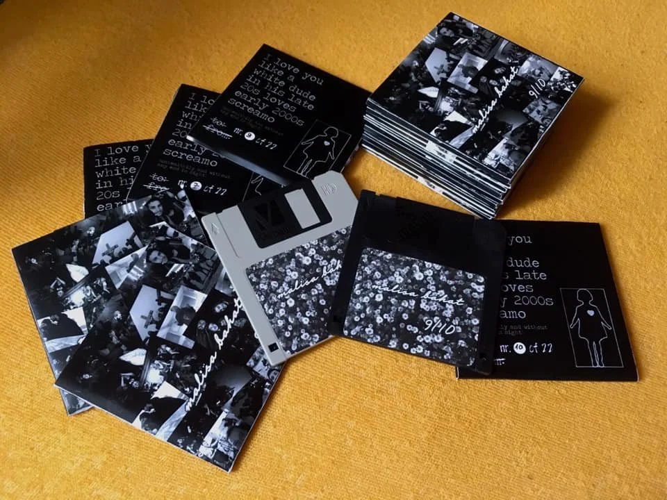 Multiple photo prints, and black cards with white text, arranged on a yellow fabric surface. The photos are black and white, showing various people and scenes, and some have handwritten notes.
