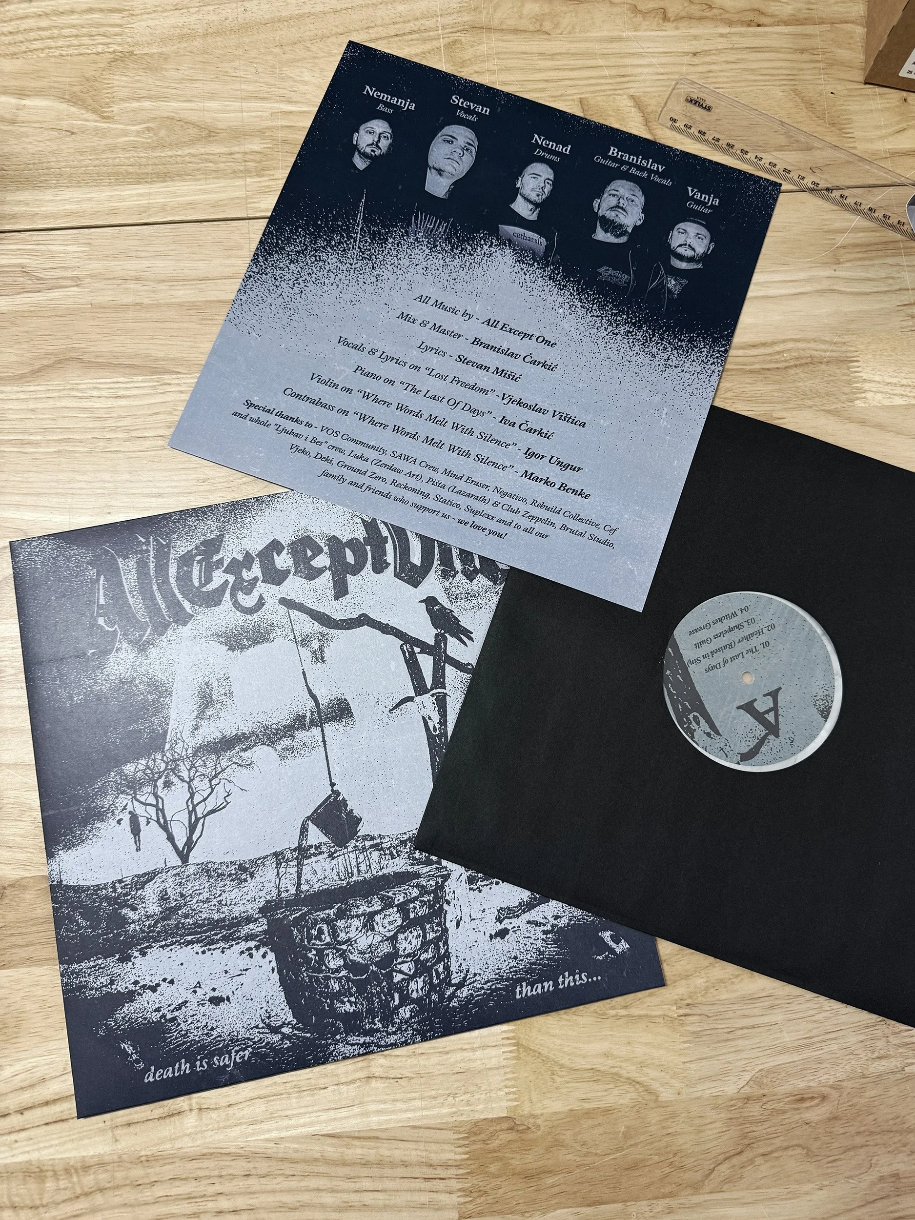 A flyer with a dark and light blue gradient background, featuring black and white photos of five band members at the top. The text details song credits, acknowledgments, and a message of love and support, with the phrase "death is safer than this..."