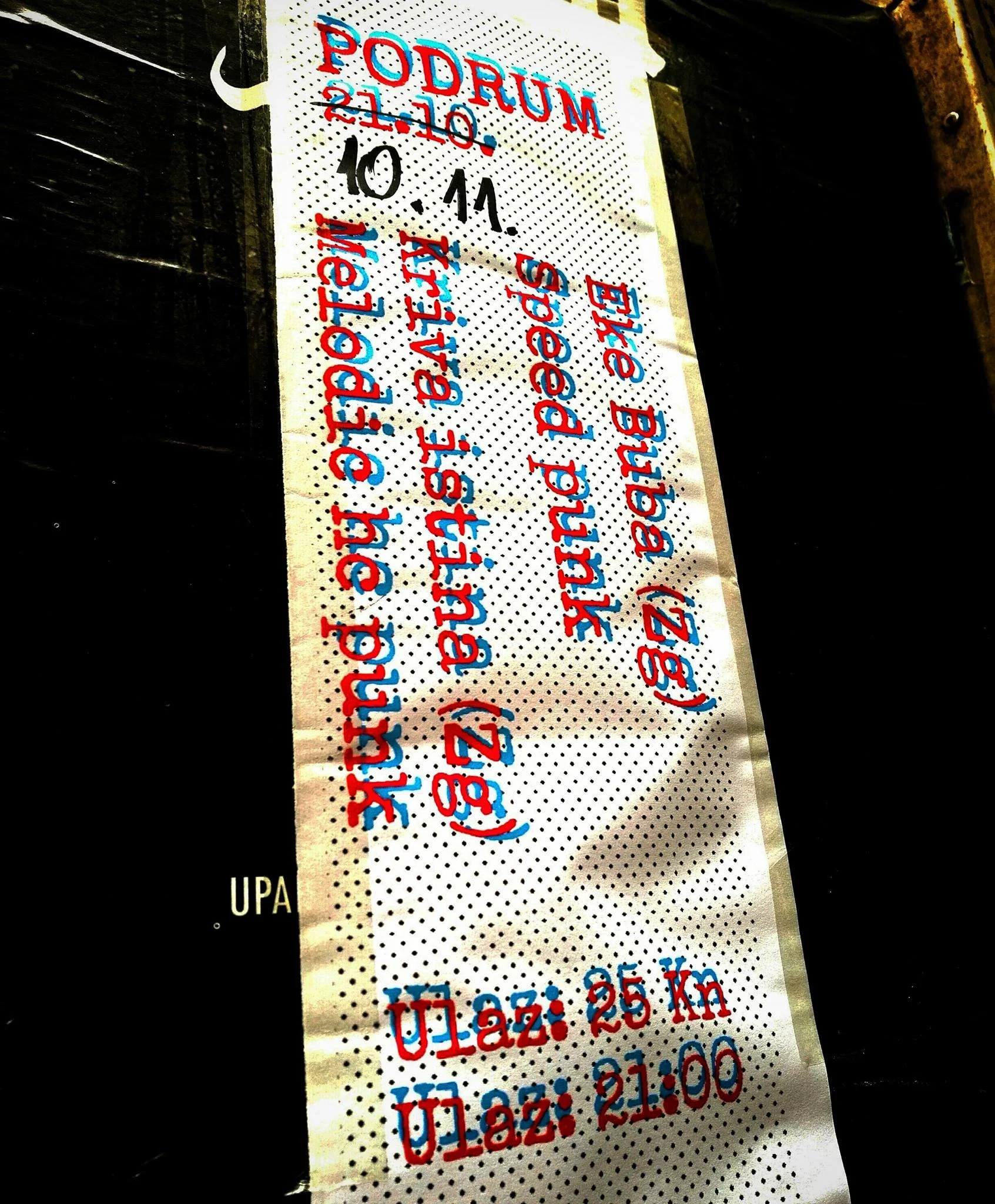 A perforated strip with handwritten text in red and blue marker listing dates and distances, including "22.10", "25 km", "26.10", "28 km", and "29.10". The heading indicates a running event at Podrum.