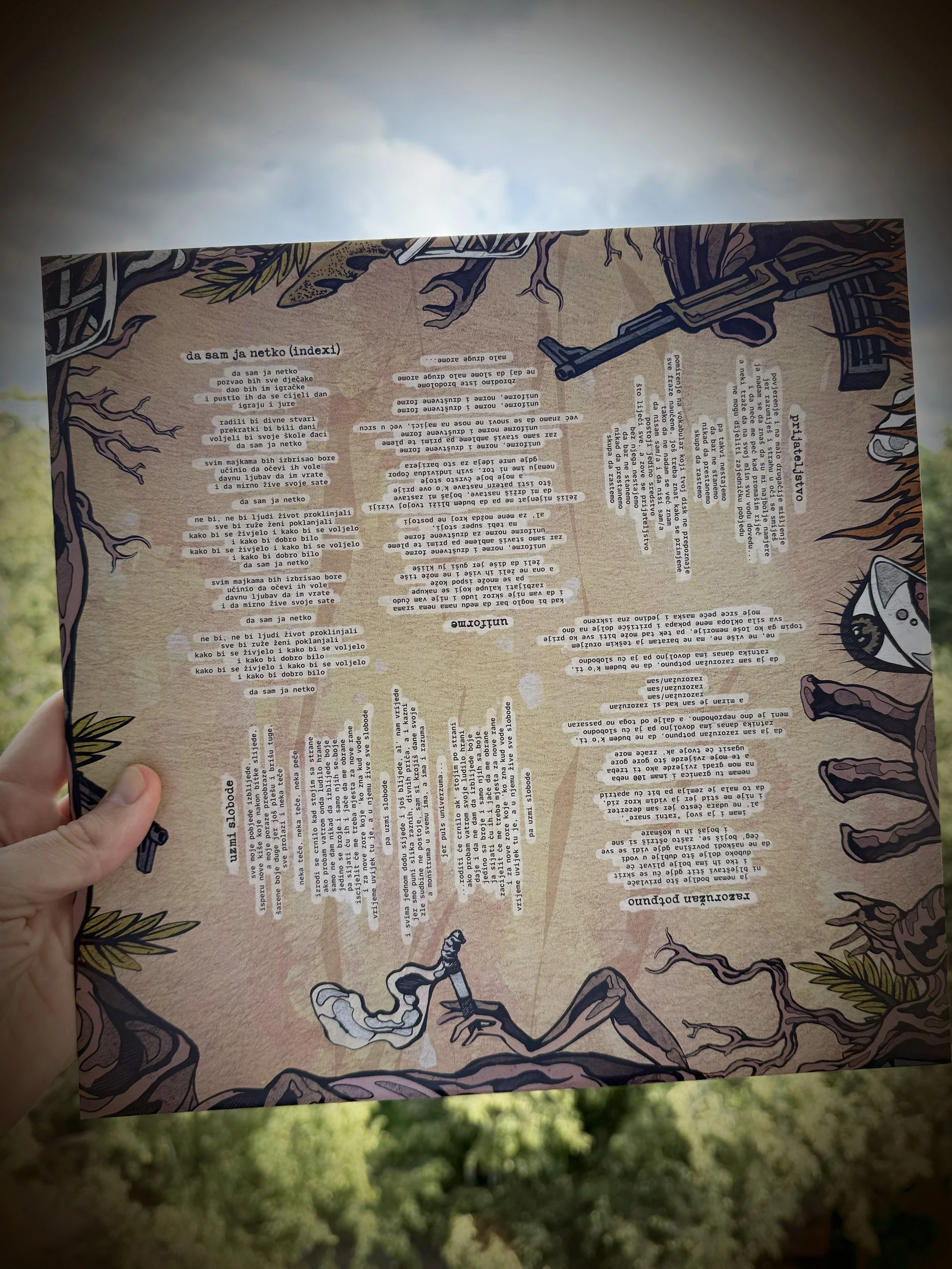 A person holding a piece of paper with typed and cut-out text in a collage style, with a background of trees and sky, and illustrated border elements of trees and animals around the paper.