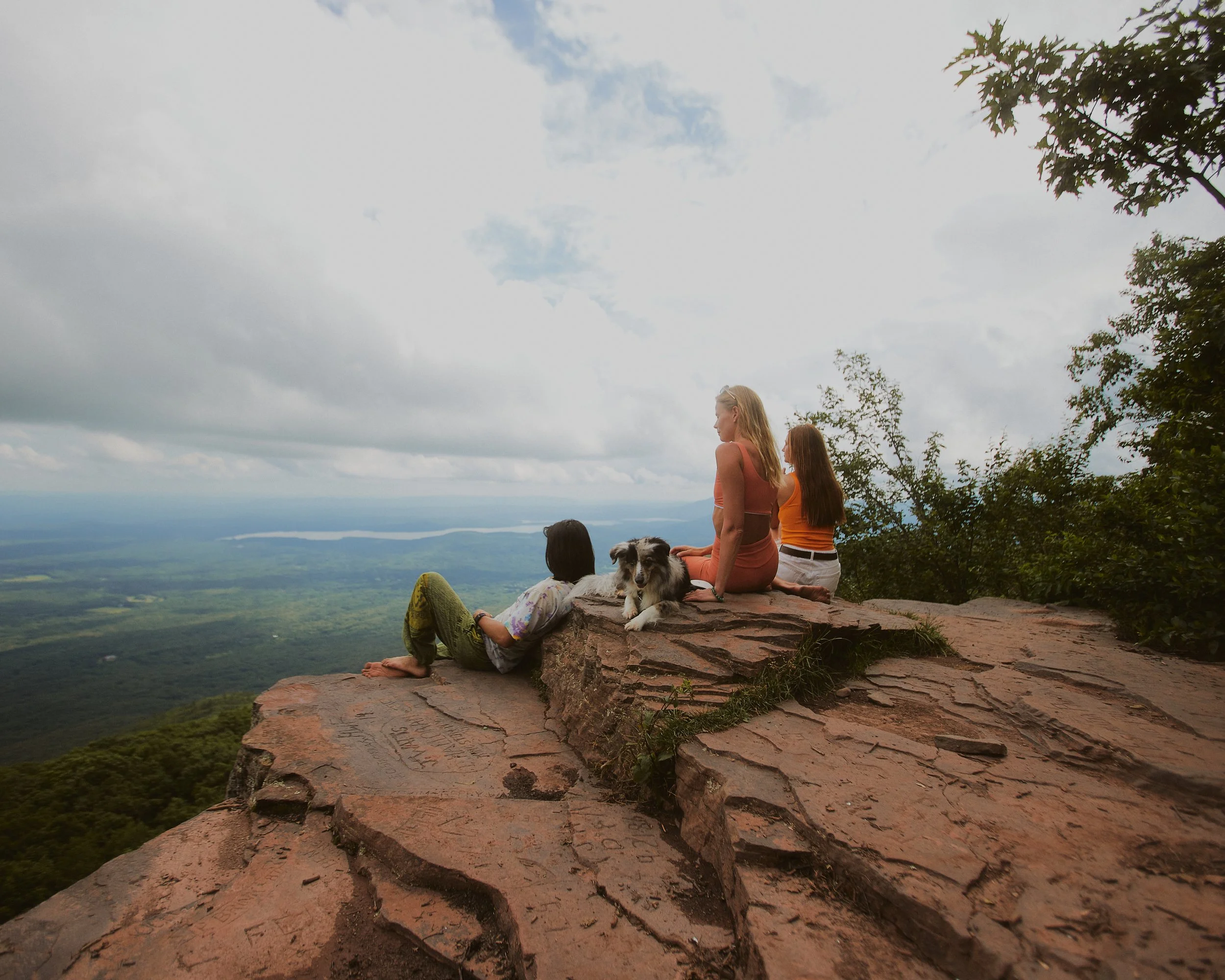 An image of friend at overlook mountain in woodstock, with a cute dog