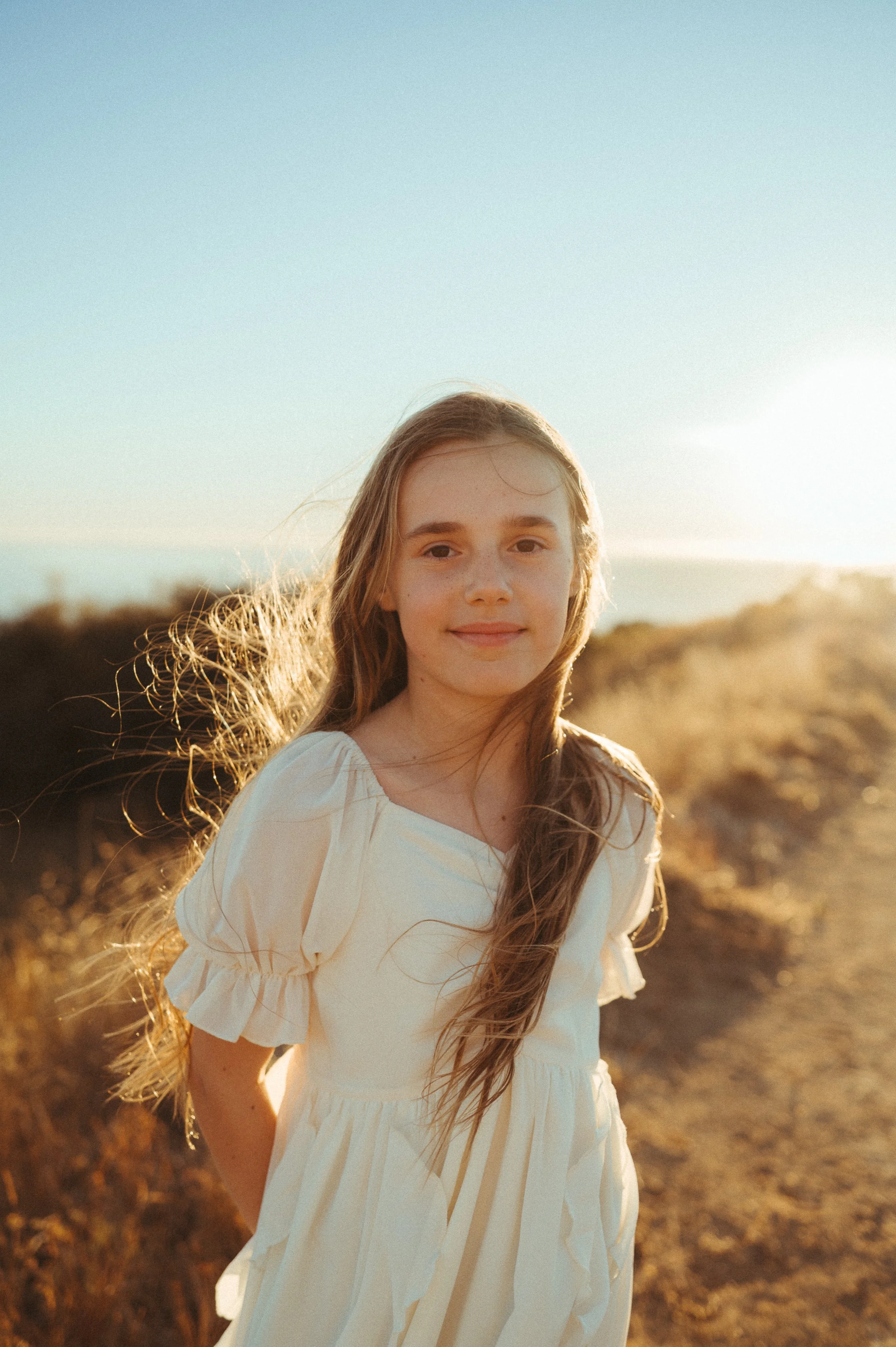 Photo of child at sunset overlooking ocean