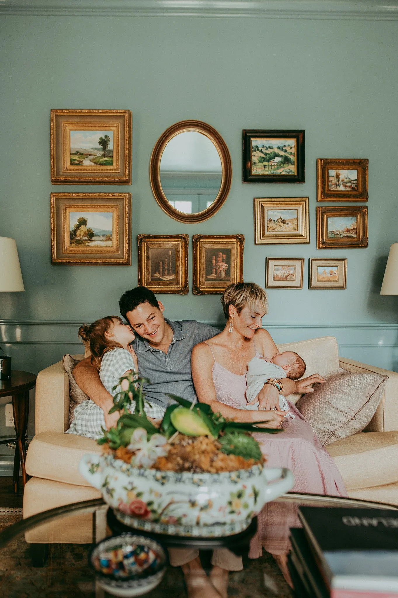 Family in stylish living room with gallery wall