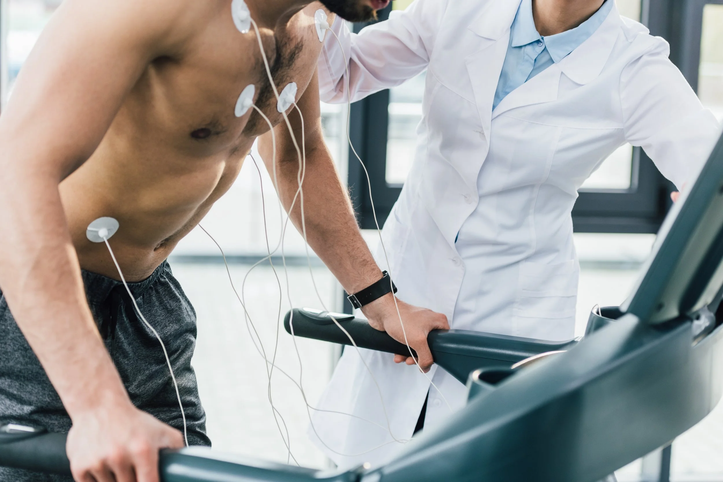 cropped-view-of-doctor-putting-electrodes-on-shirt-2026-01-06-00-43-05-utc.jpg