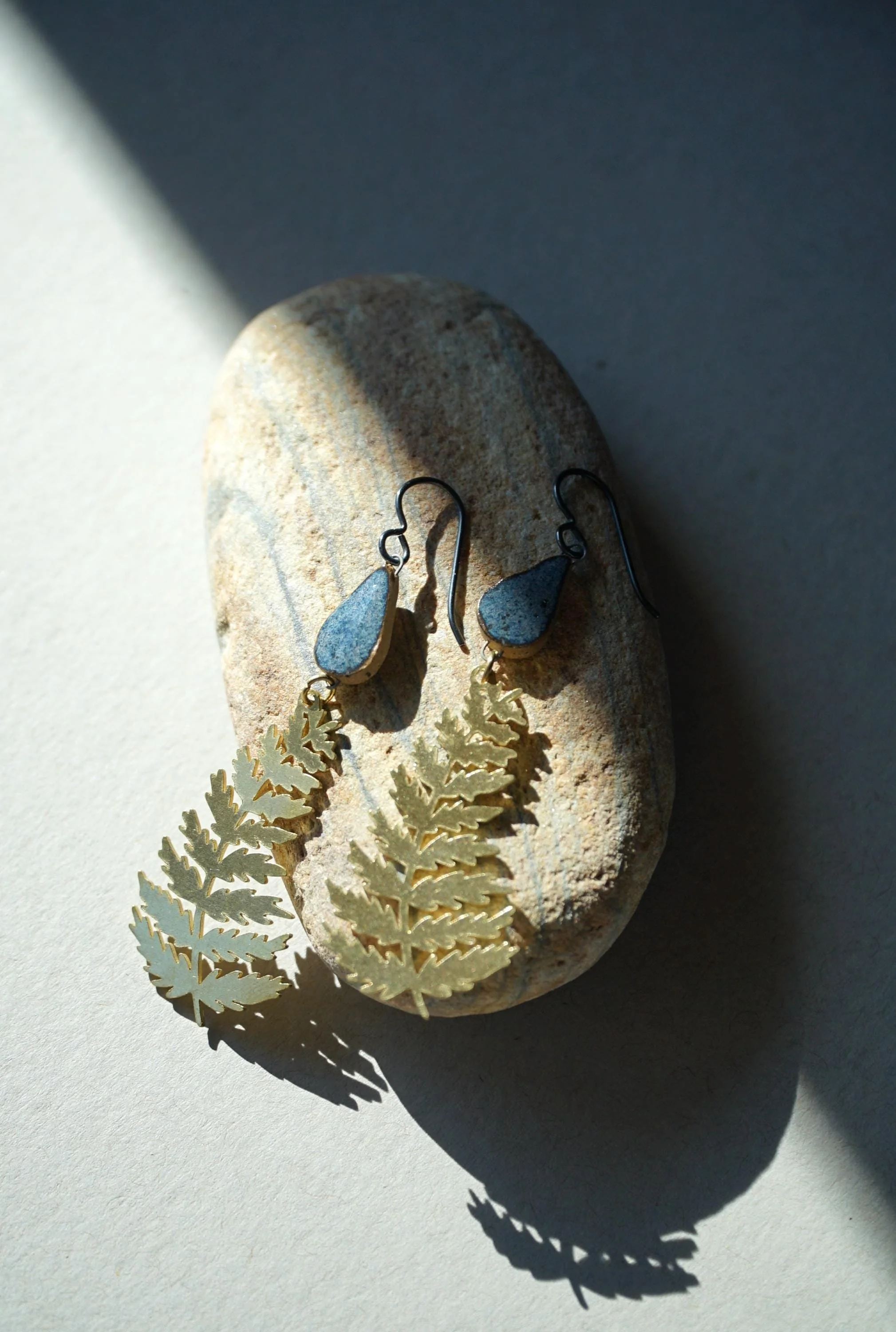 Handcrafted Stoneware Earrings – Blue Glazed Teardrop Ceramic Bead & Brass Fern Charm – Hypoallergenic Niobium Hooks