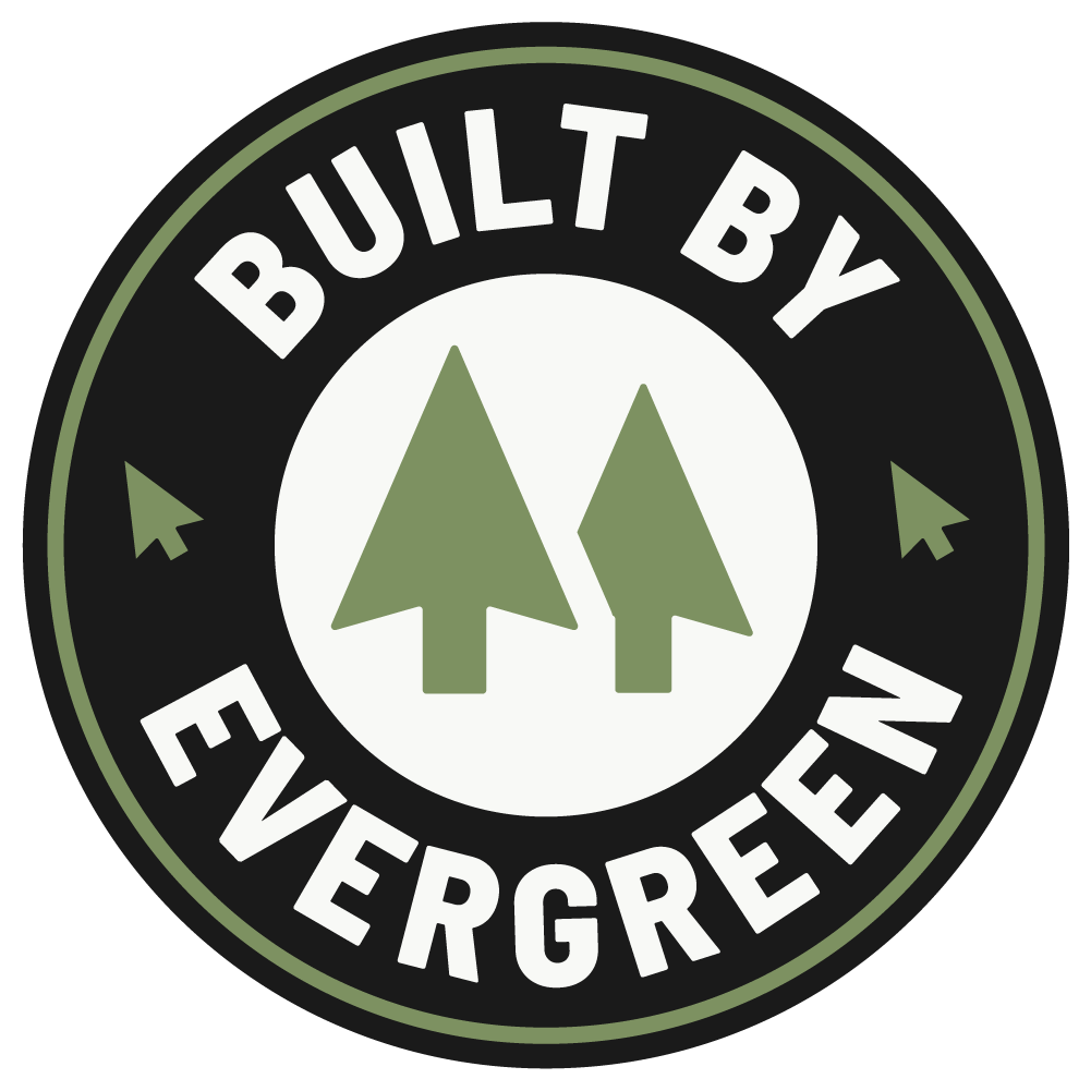 Circular emblem with the text "Built by Evergreen" and two green pine trees in the center.