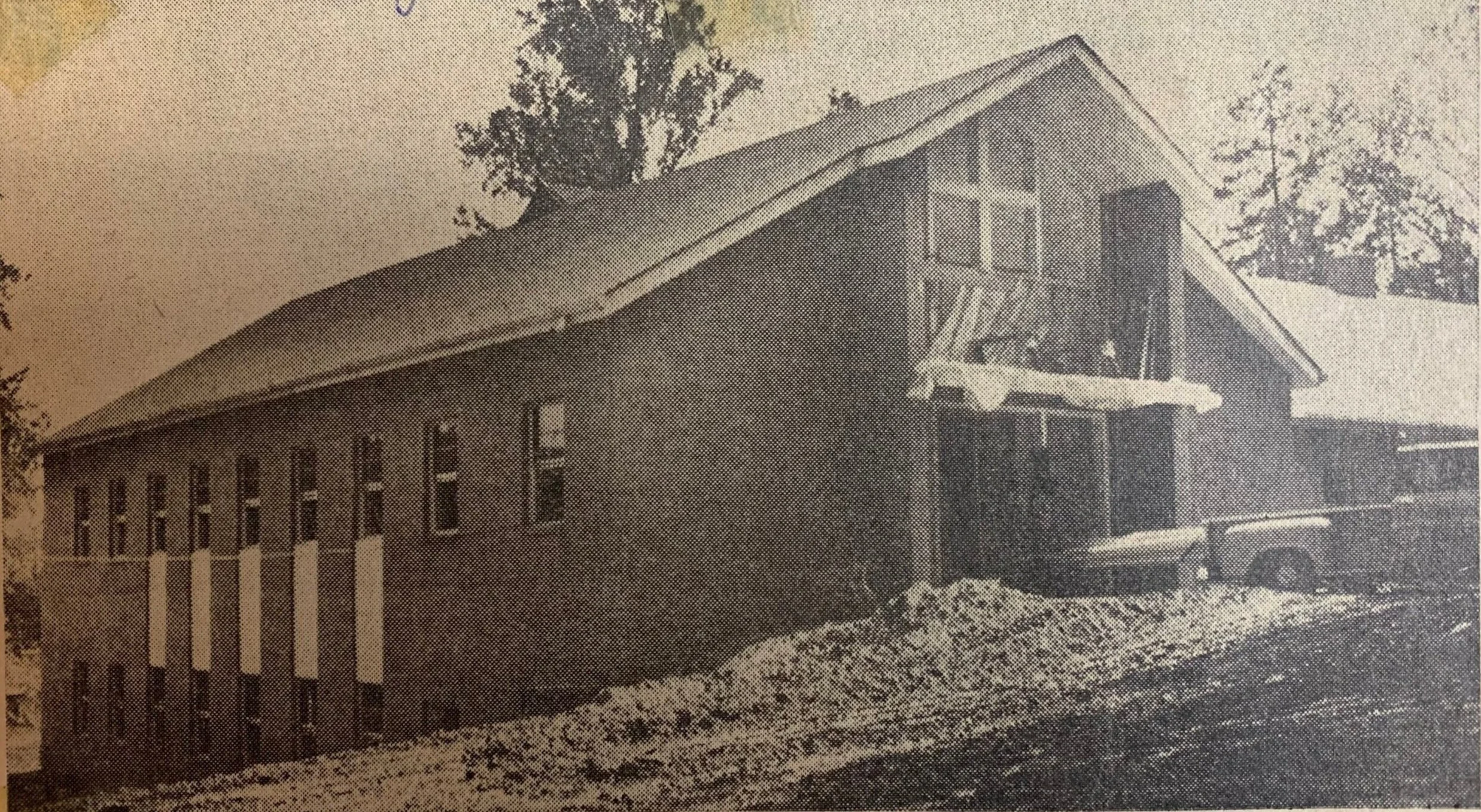 A newspaper clipping from June 12, 1963 showing the church building under construction, about a month before completion.