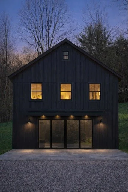 The 2-story Catskills Makery building at twilight. The building is all black.