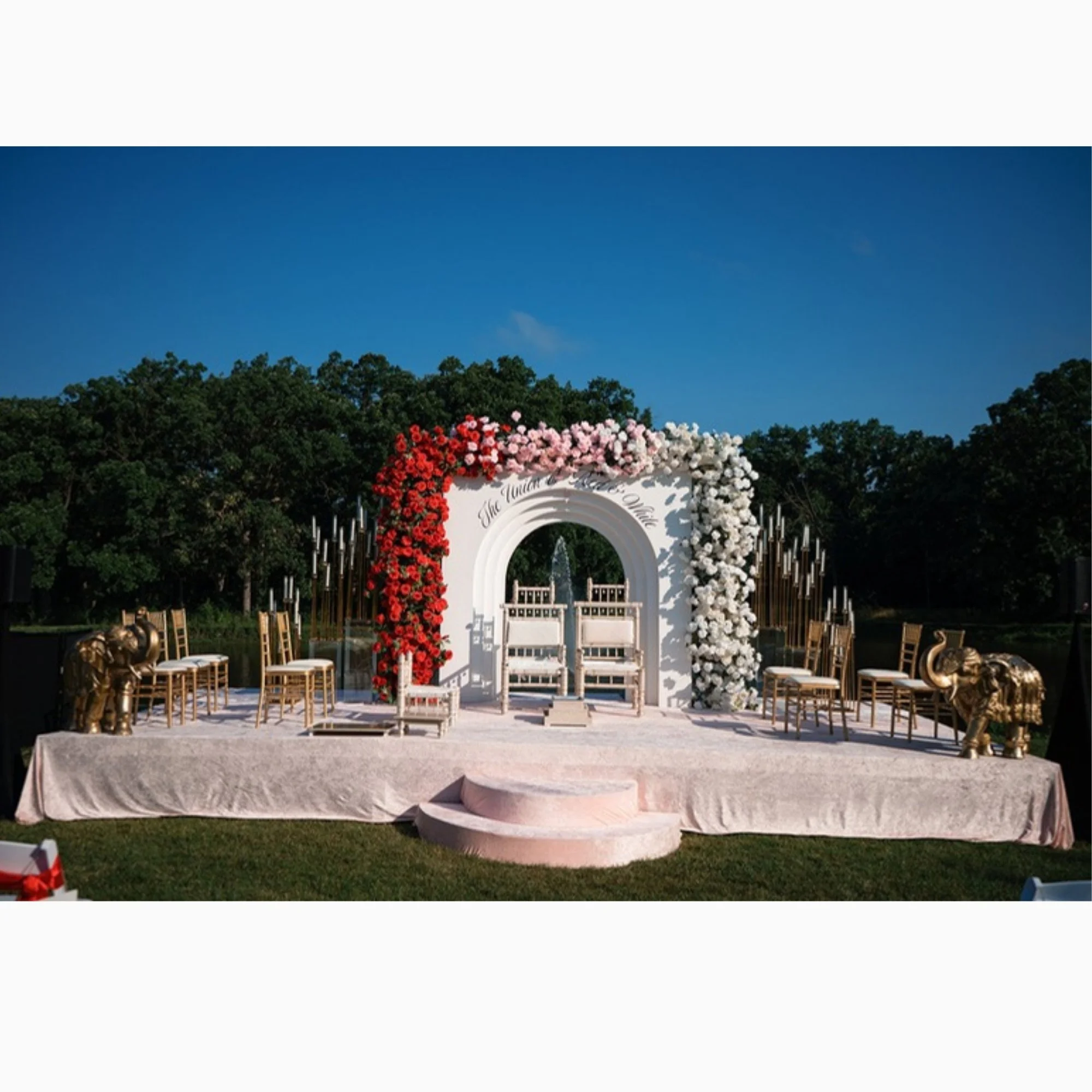 outdoor-floral-arch-stage-at-night.jpg