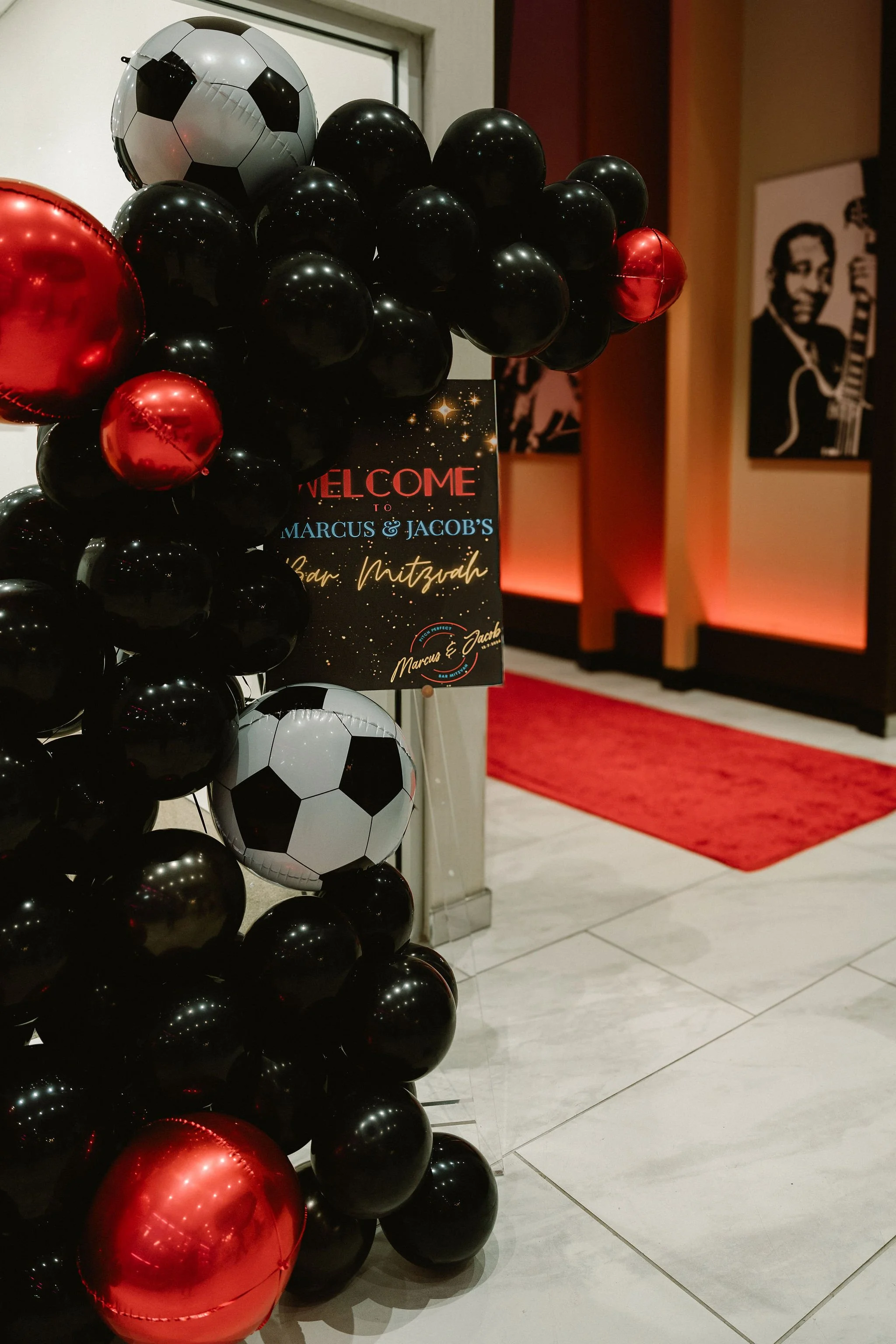 Balloon-art-welcome-custom-sign-jewish-bar-mitzvah-red-carpet-club-theme-party-event.jpg