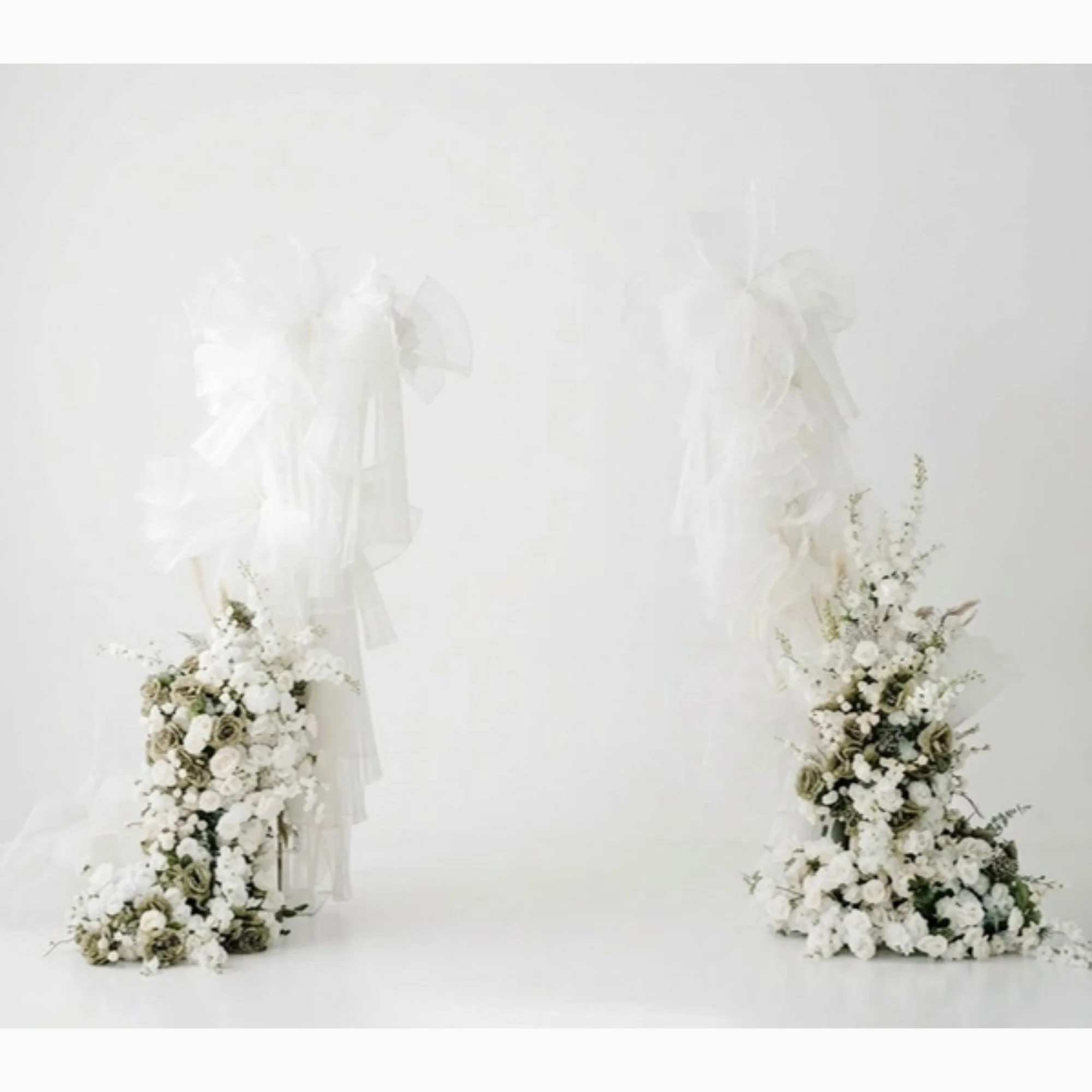 white-feather-and-floral-pillars.jpg