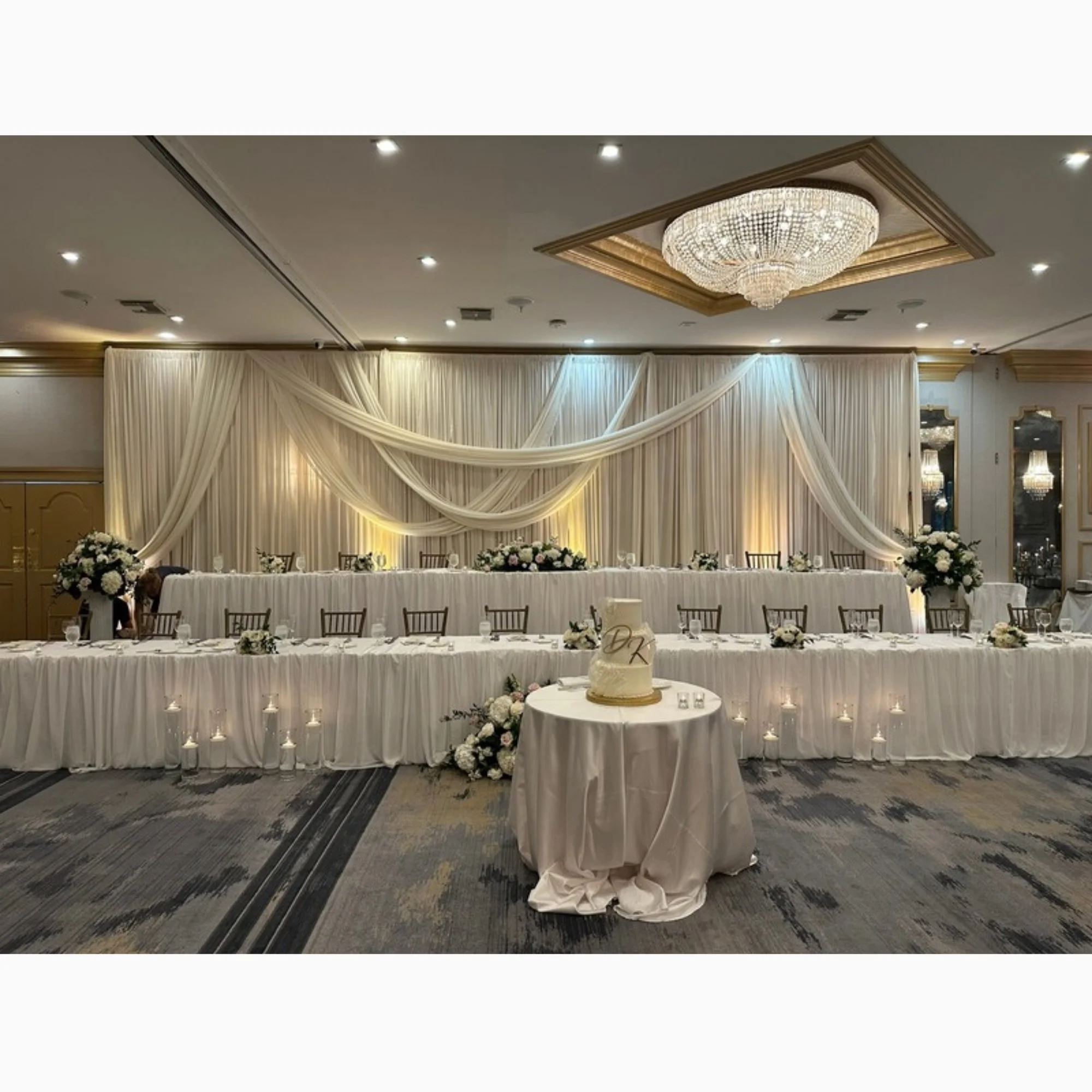 white-wall-draping-behind-head-table.jpg