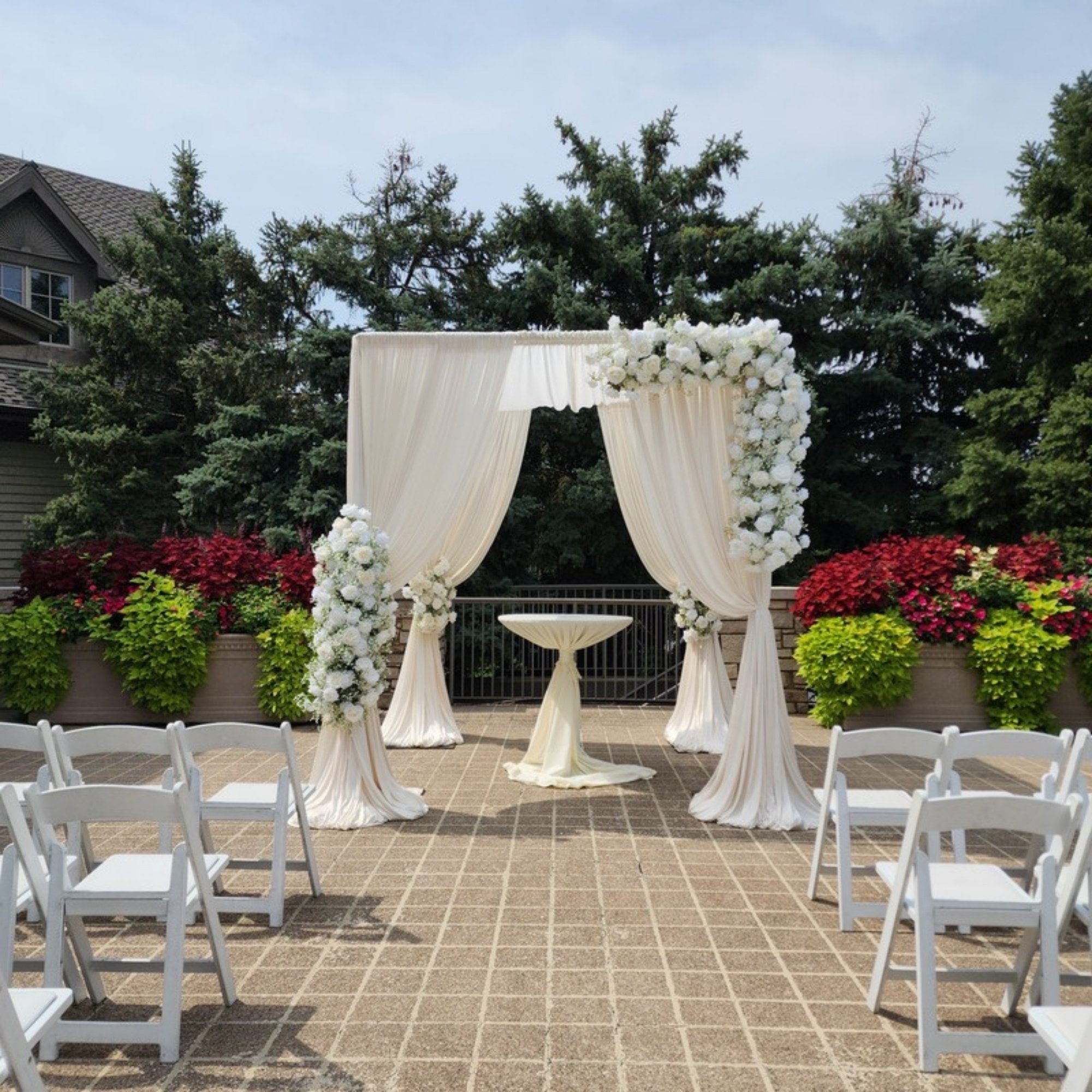 outdoor-ivory-draped-ceremony-arch.jpg