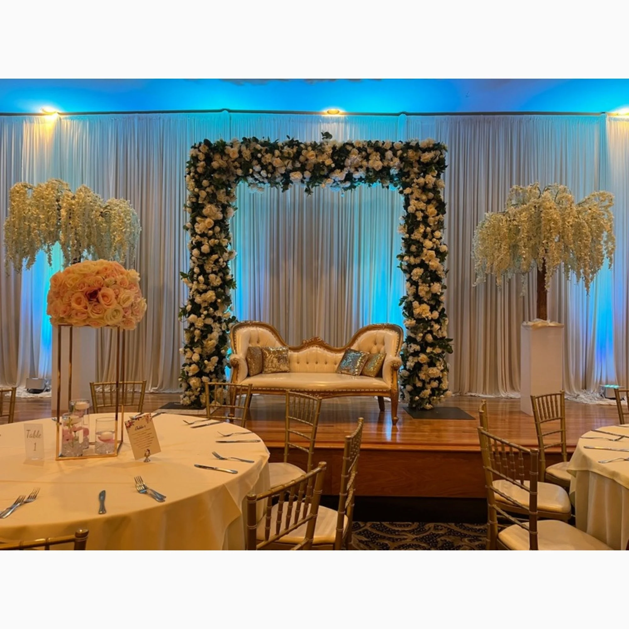 stage-with-floral-frame-and-loveseat.jpg
