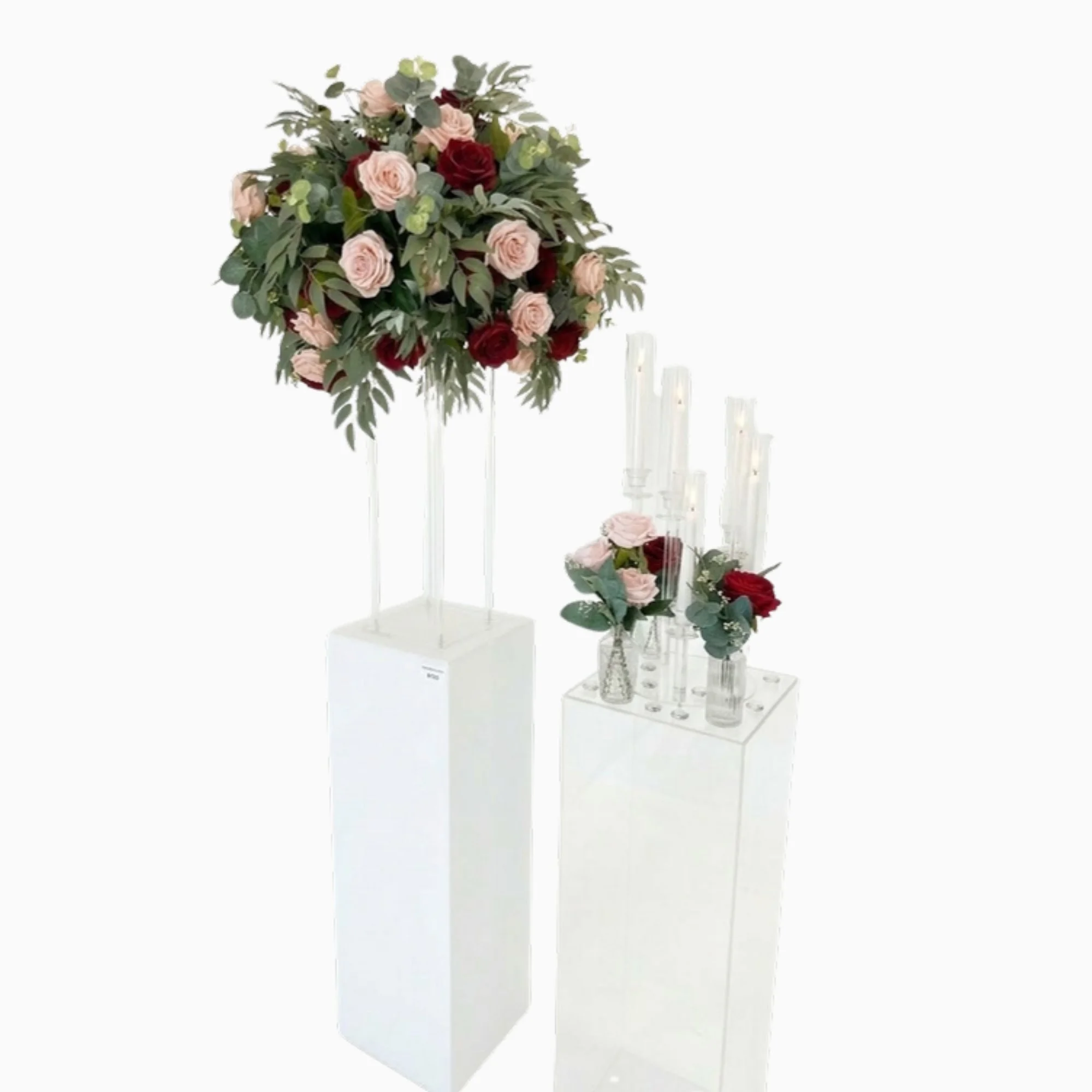 white-pedestals-with-floral-toppers.jpg