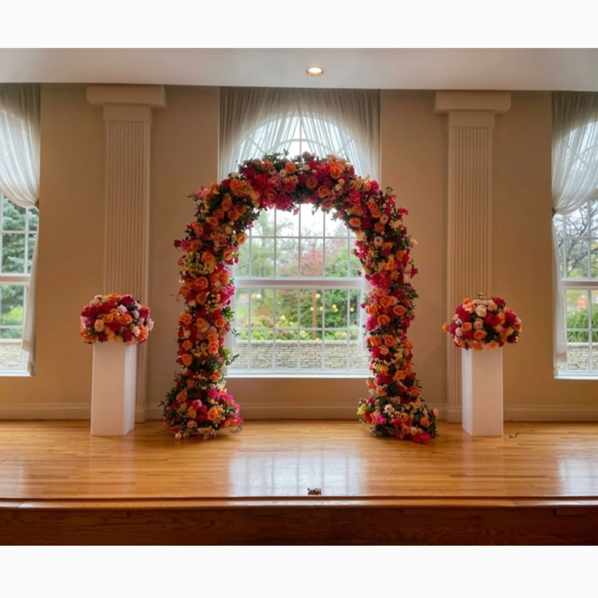 red-floral-arch-on-stage.jpg