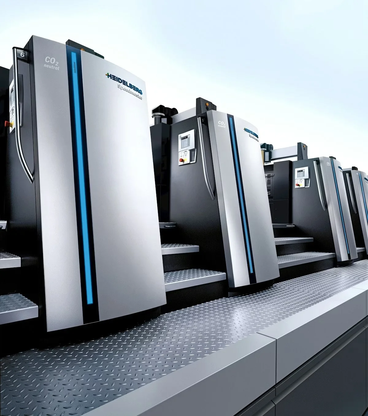 Line of large, modern technological machines labeled 'Heidelberg', with blue and black accents on a metallic platform under a cloudy sky.