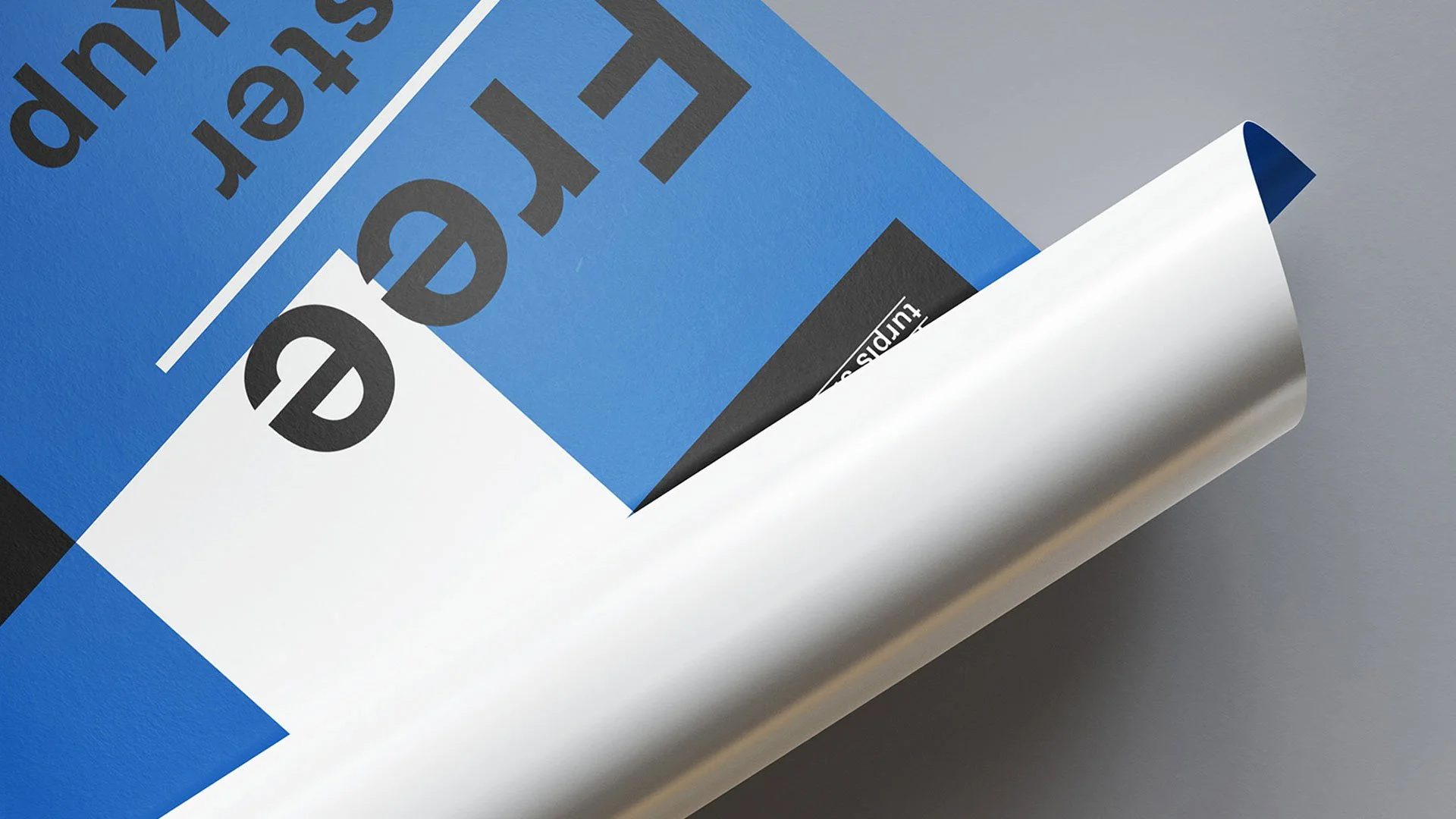 Close-up of a document partially unrolled showing the iPad app interface with text and graphics.