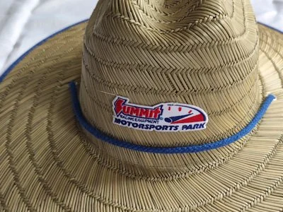 A straw hat with a blue band and a logo that reads 'Summit Vortex Championship Motorsports Park'.