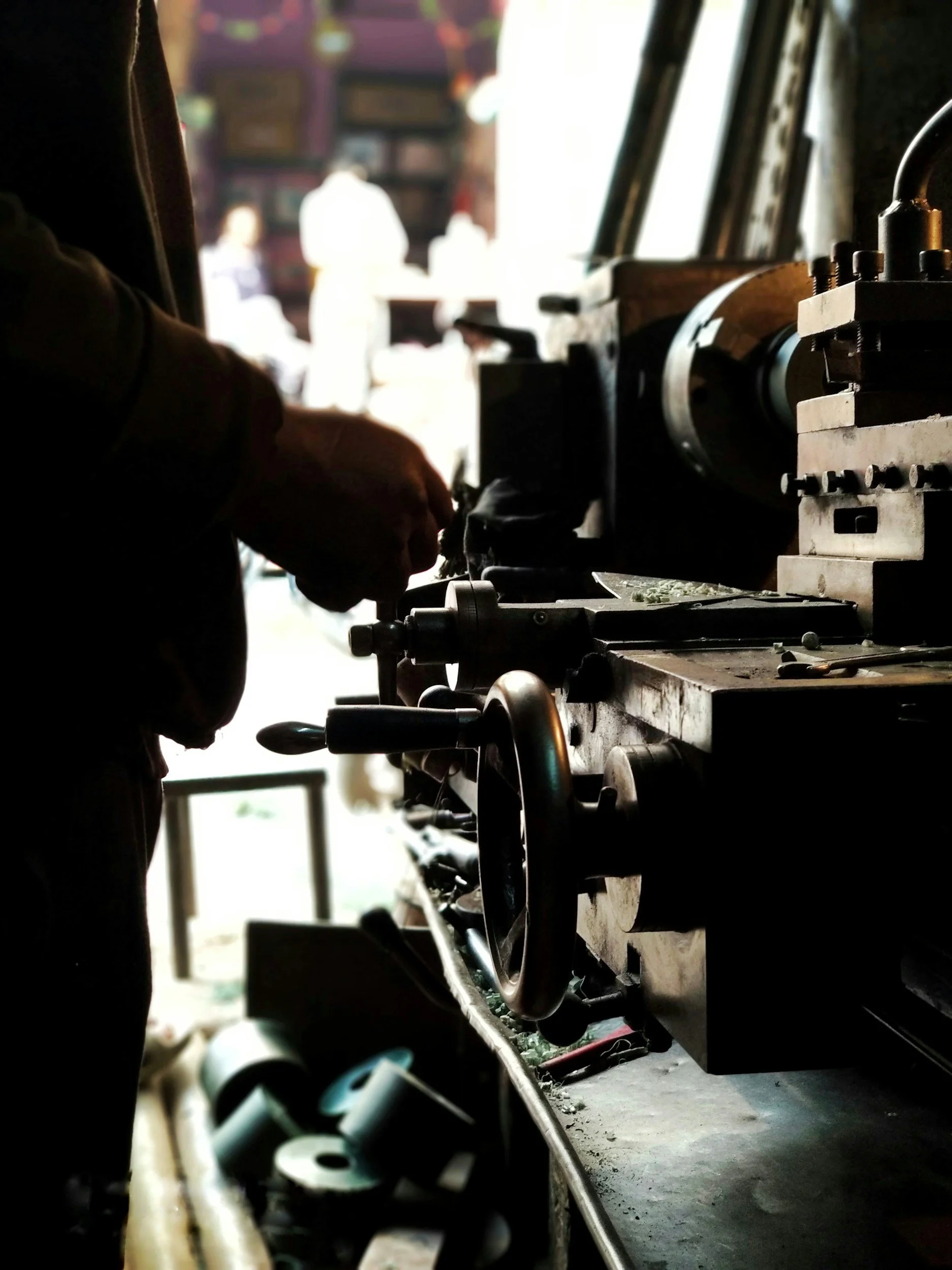 A close-up of a manual lathe in the tool room used for creating custom in-house tooling for fasteners.