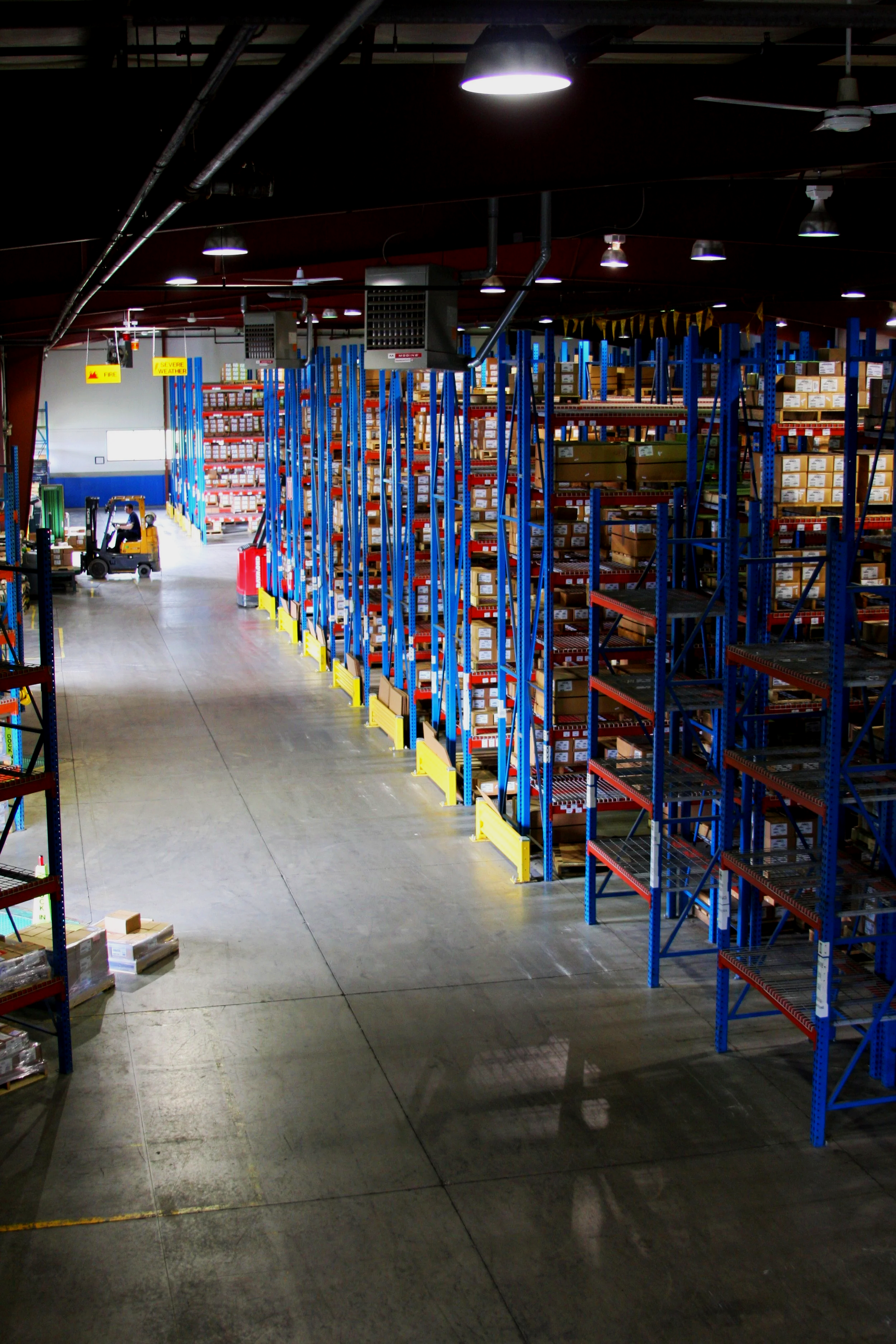 View of organized warehouse racking in the Grand Rapids distribution center for fastener inventory management.