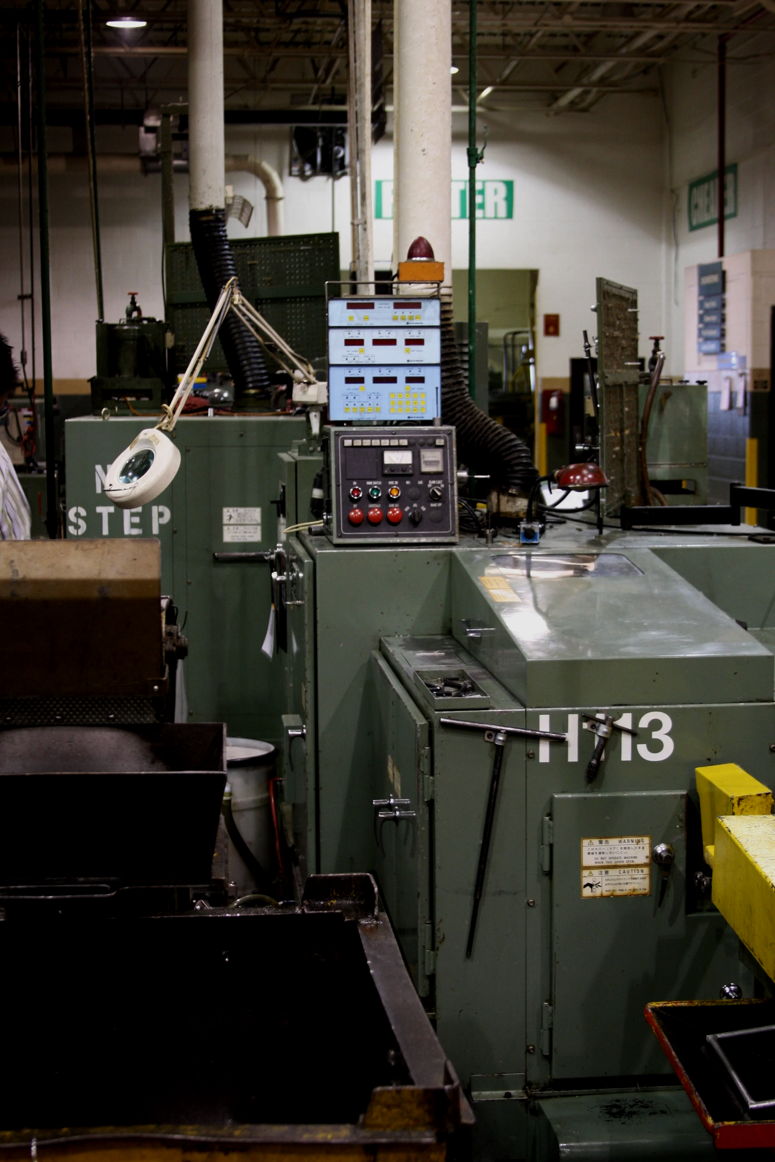 Industrial cold forming machinery manufactured by Nakashimada for high-volume fastener production.