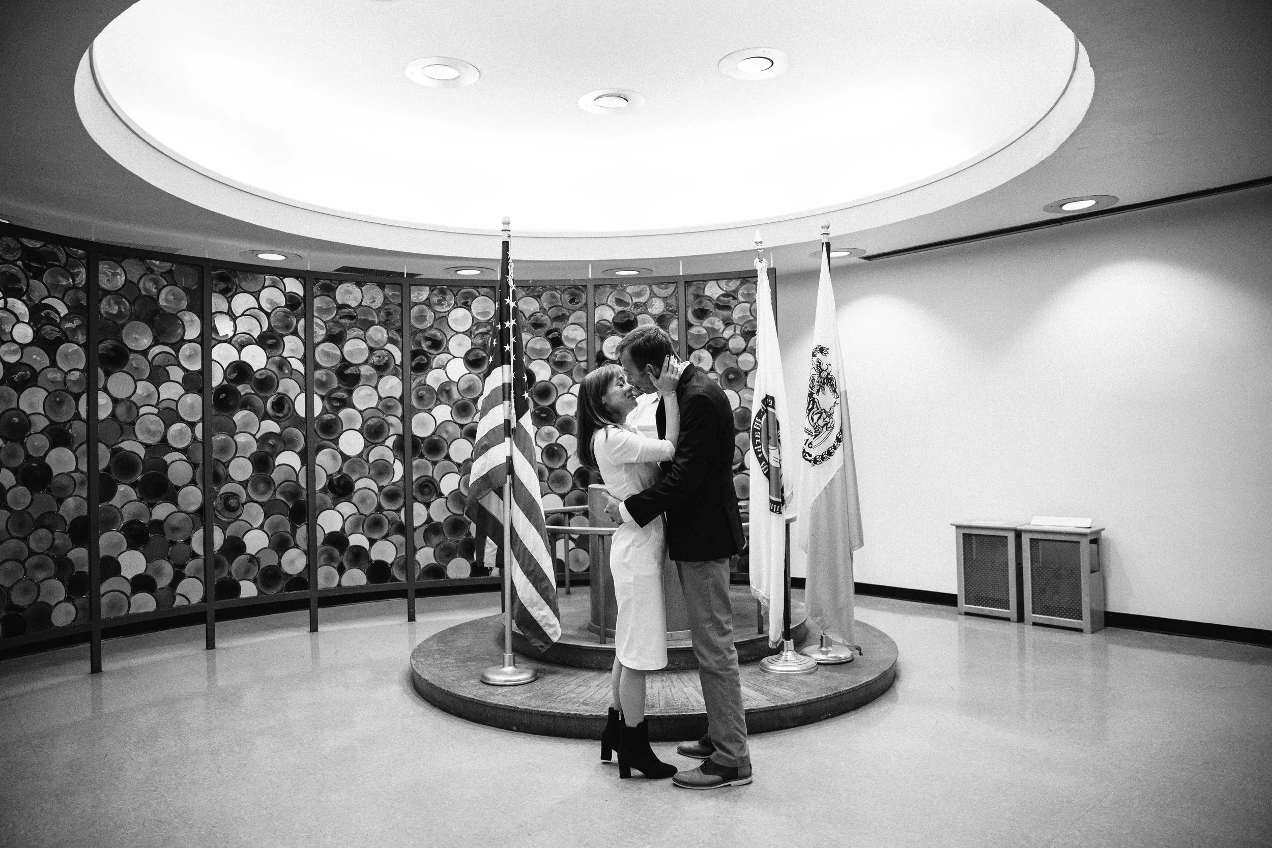 A couple in wedding getting married in City Hall. Documentary wedding photography in NYC
