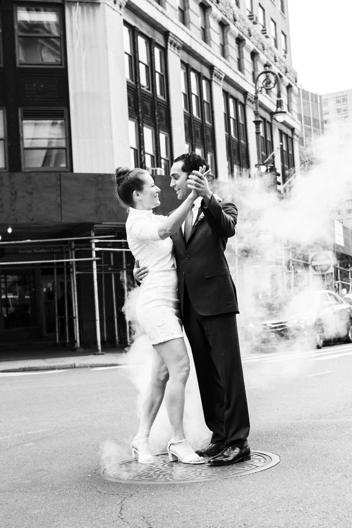 Couple dancing in NYC street — black and white elopement photography