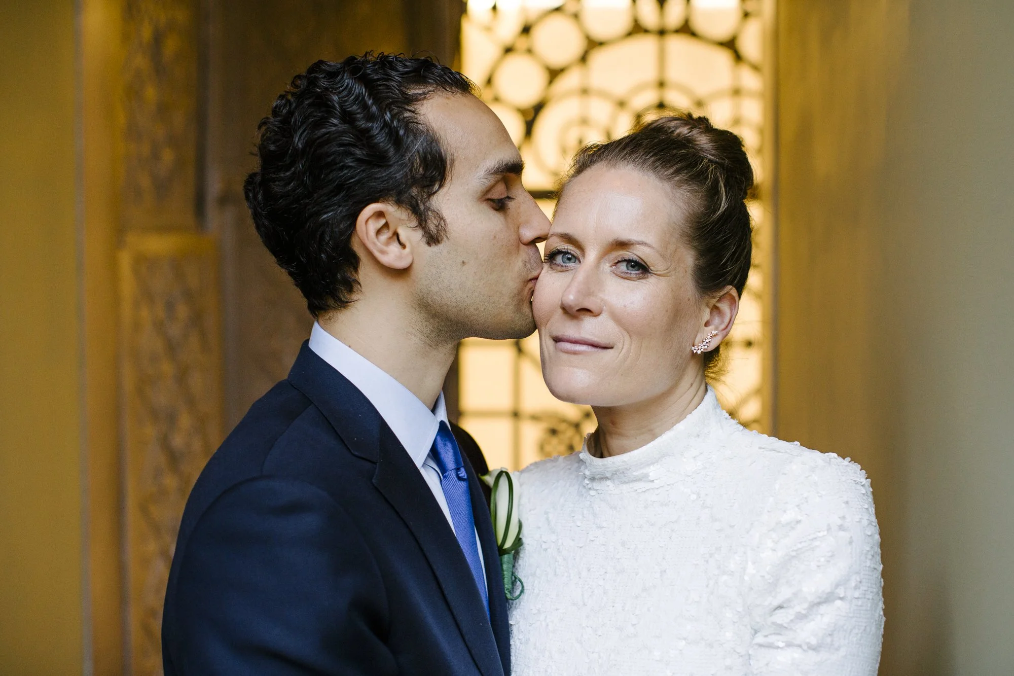 Groom kissing bride during emotional moment — NYC elopement photography