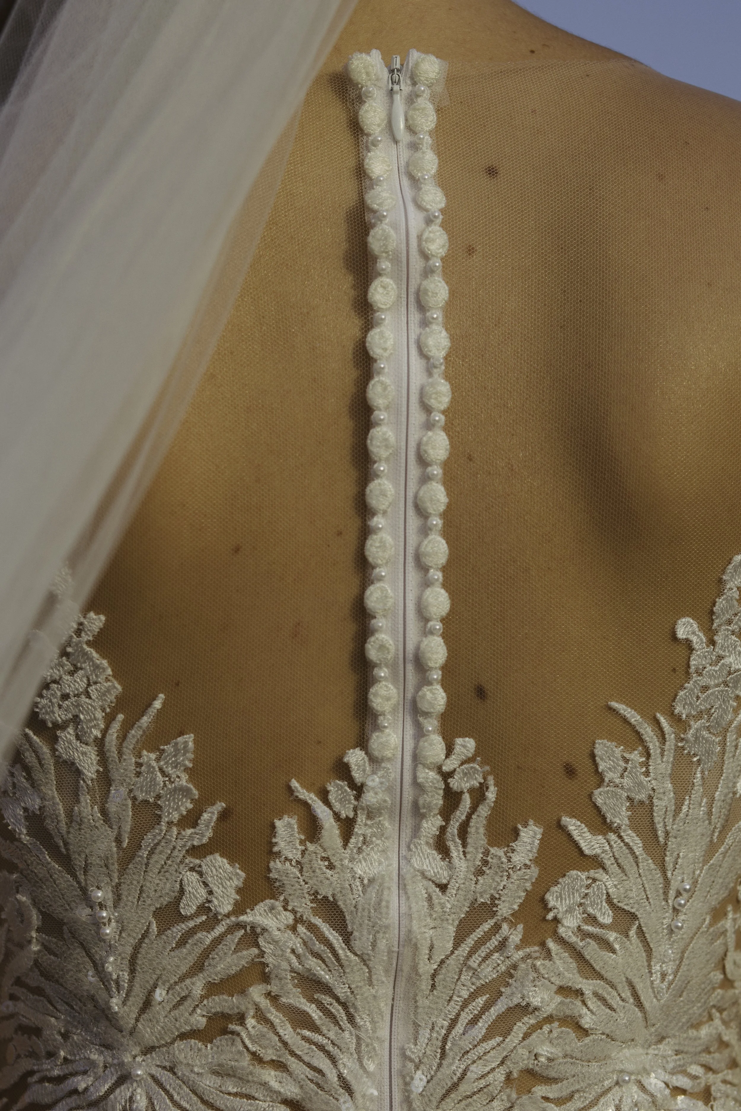 Detail of wedding dress lace and buttons — New York City wedding photography