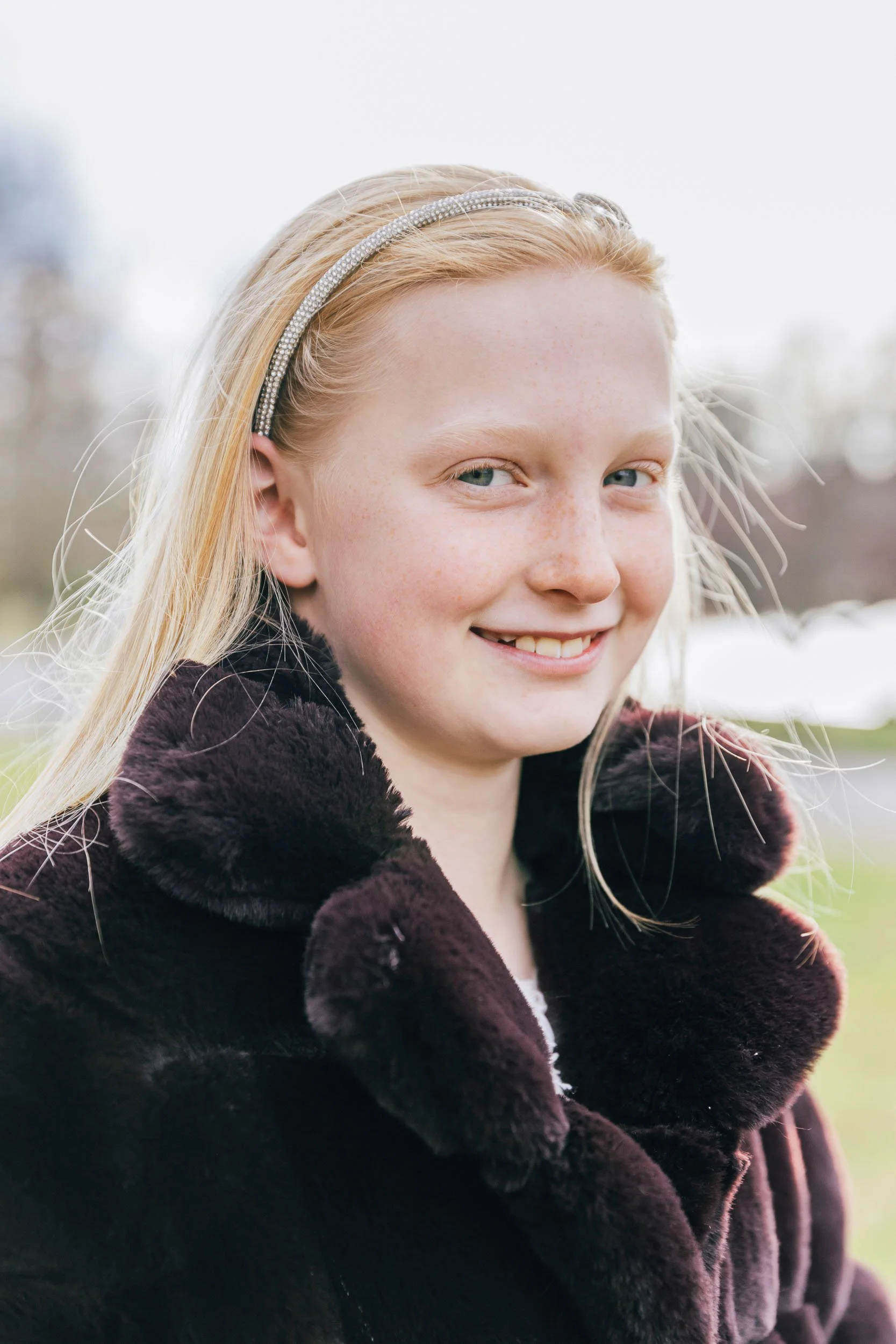 Young girl smiling outdoors family portrait — Greenwich Connecticut family photographer