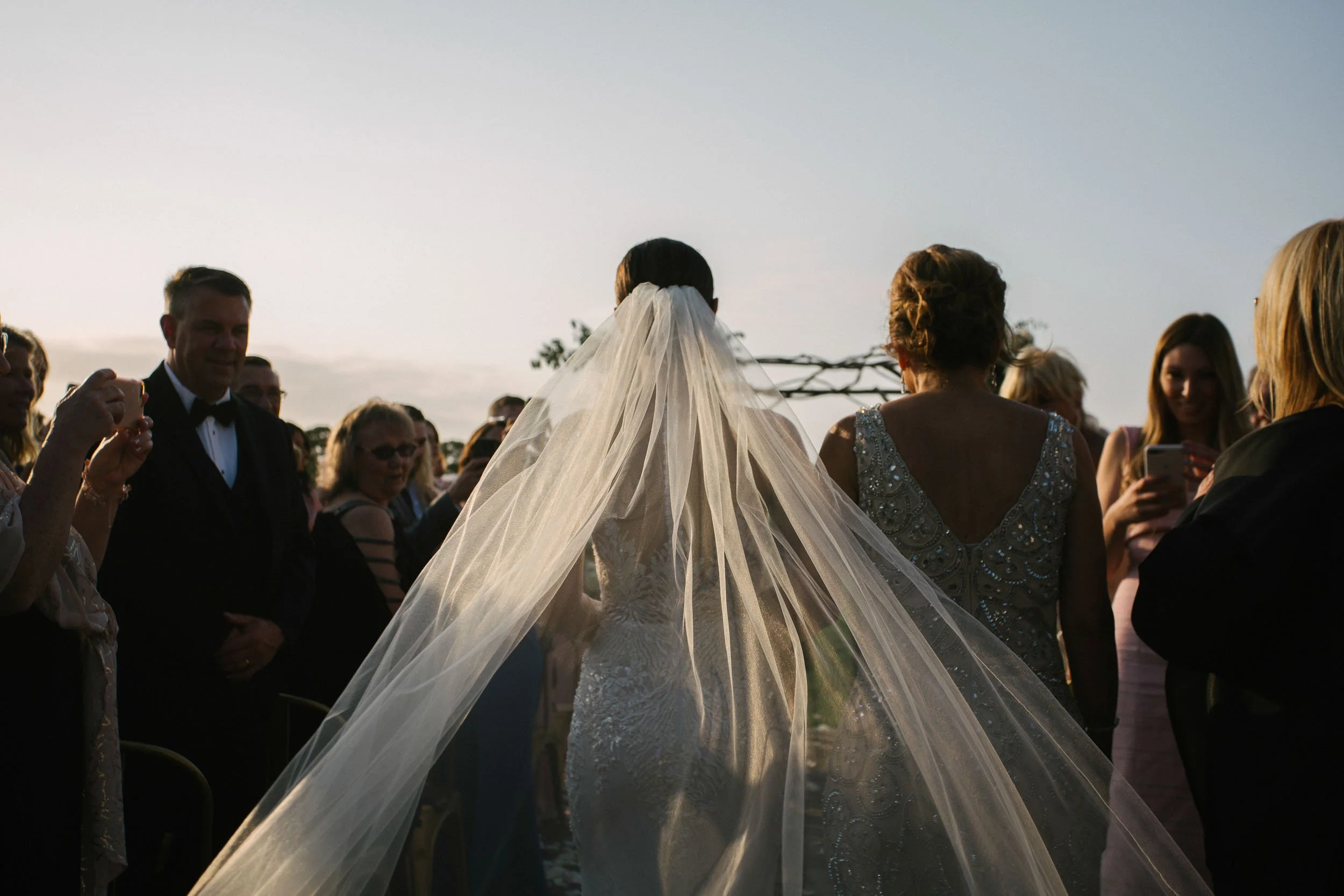 Bride walking outdoors at sunset during a New York City wedding — NYC wedding photographer