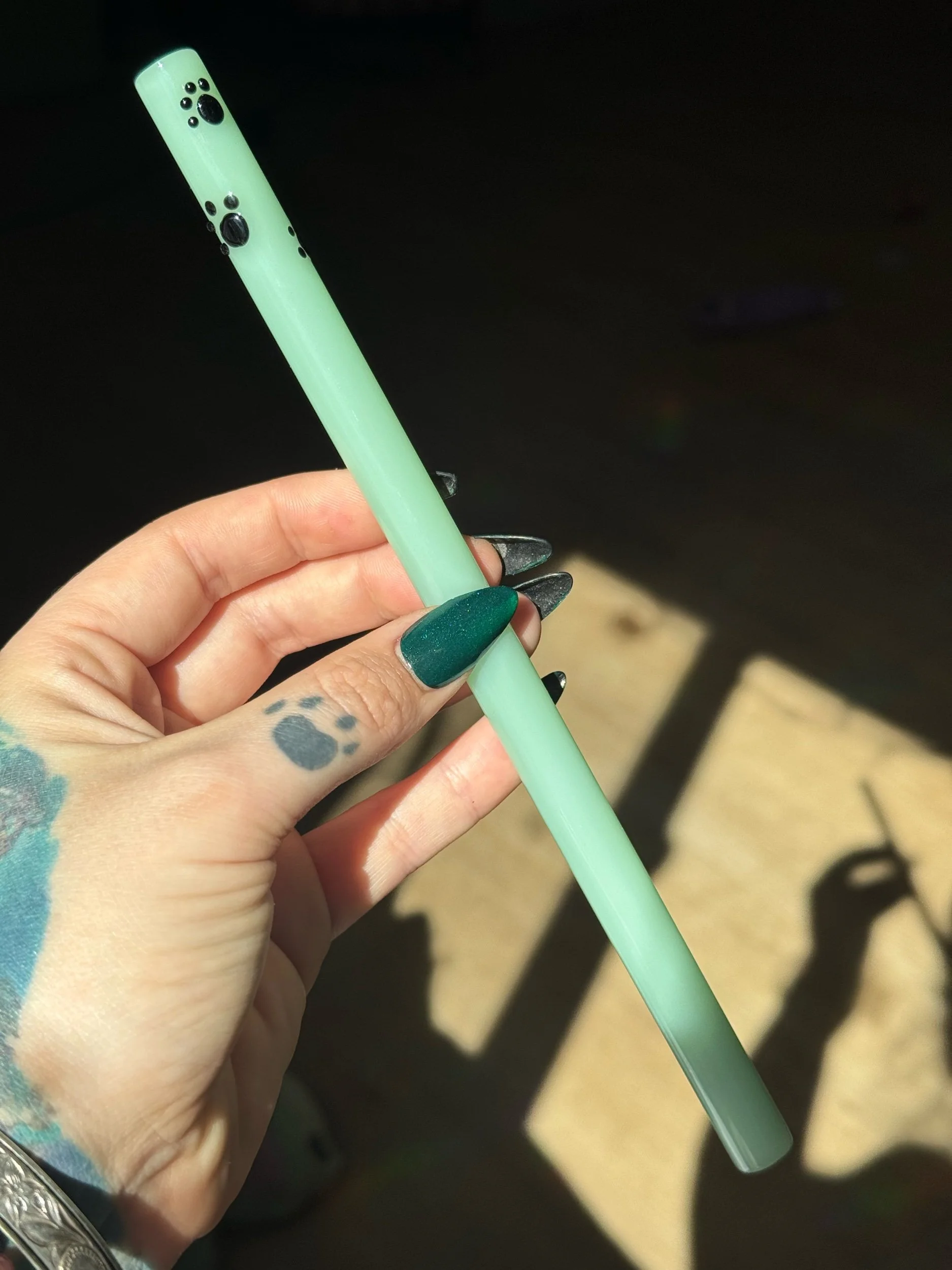 Mint green glass straw with black paw prints