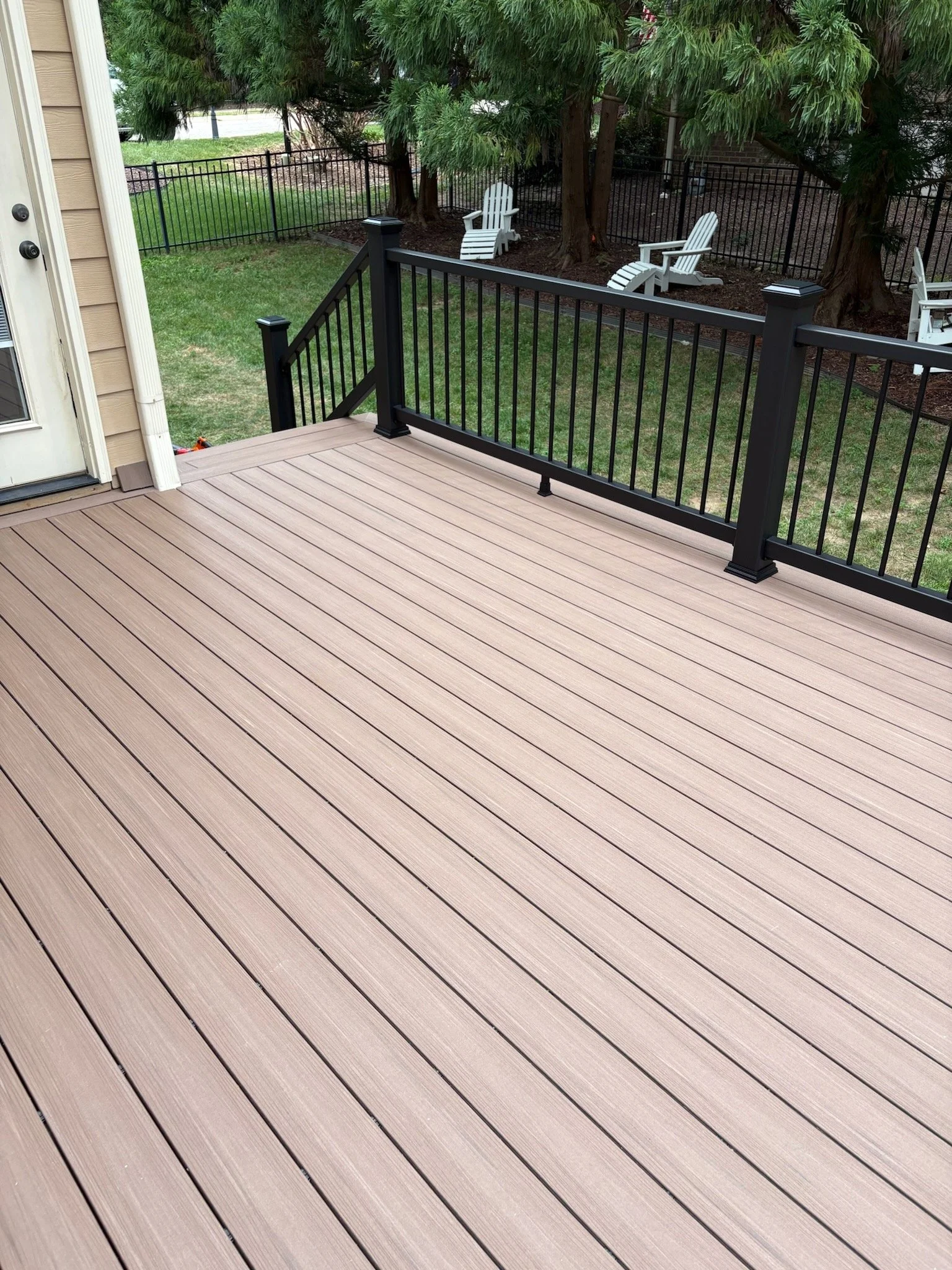 Deckorators Summit composite deck and Trex Enhance railing