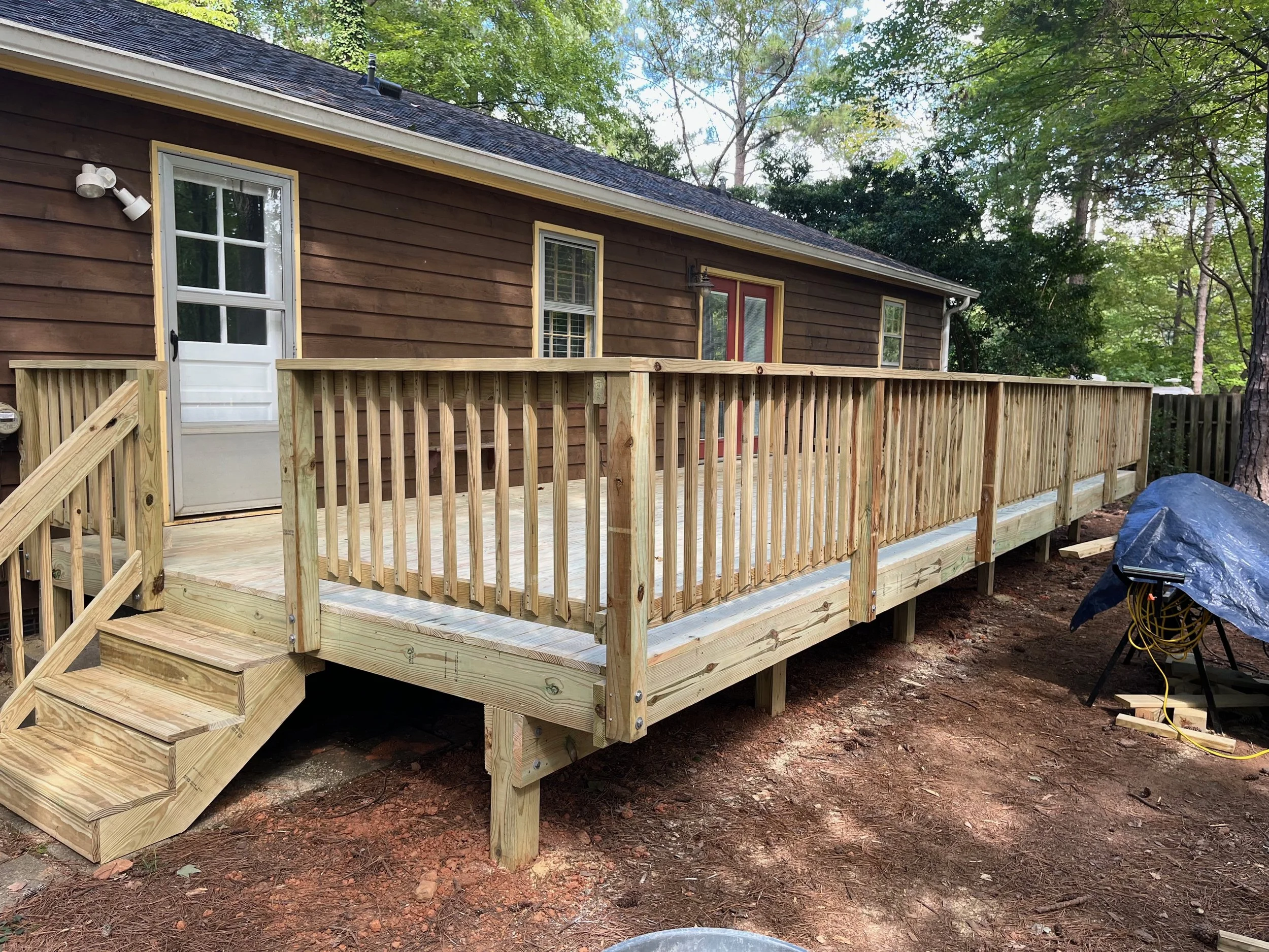 new deck with railing and stairs