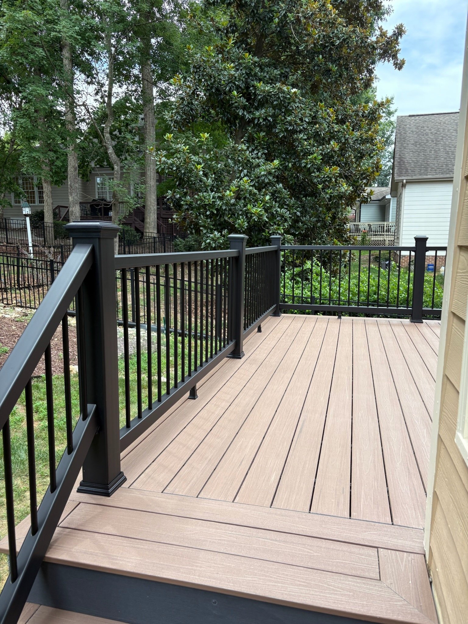 Deckorators Summit composite deck and Trex Enhance railing