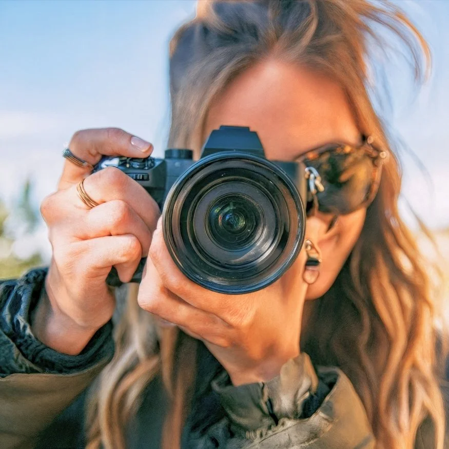 teen using a camera at charleston photography camp.jpg
