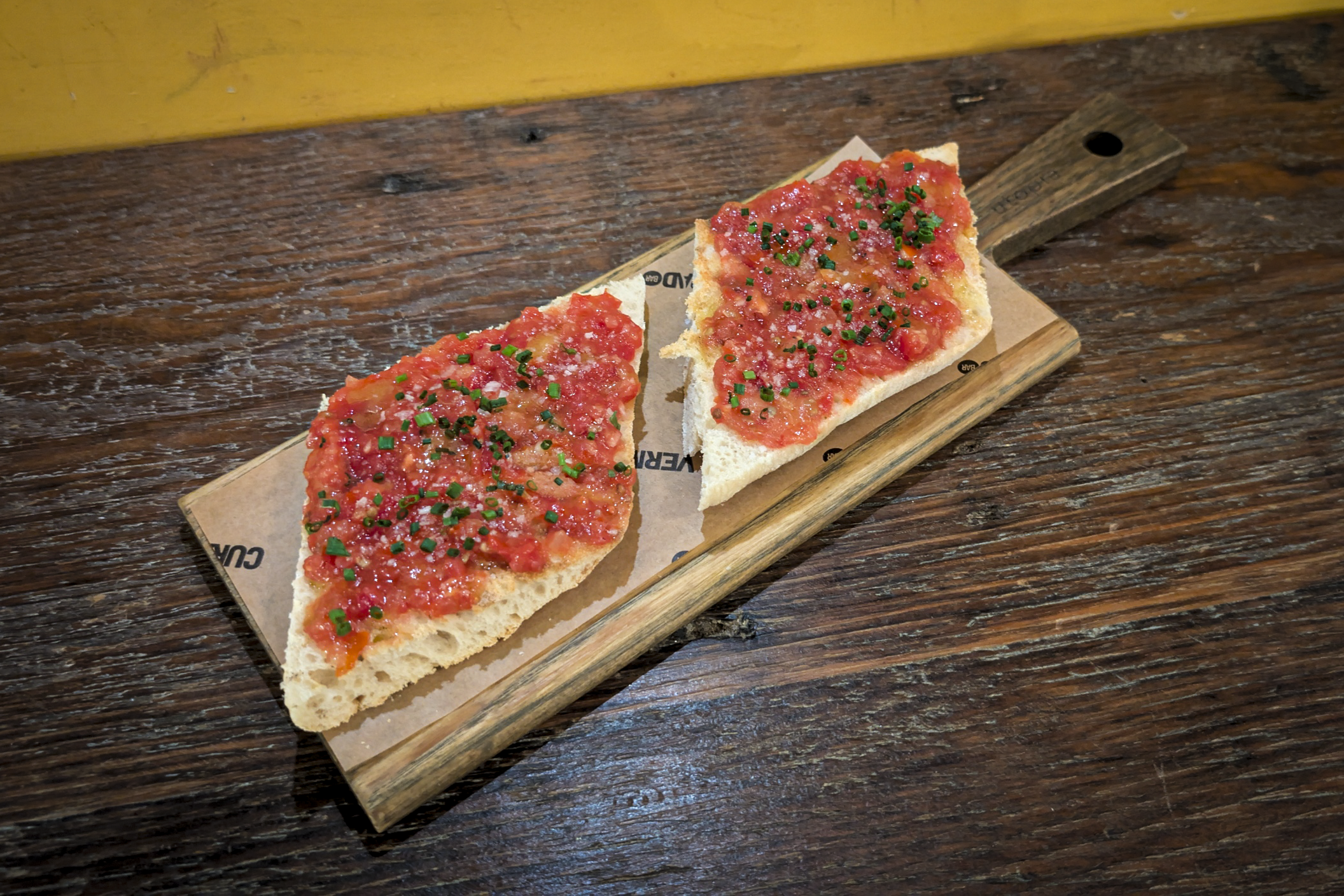 Tostada con Tomate - A classic Spanish snack, grilled Valencian sourdough topped with grated tomato, garlic and olive oil.
