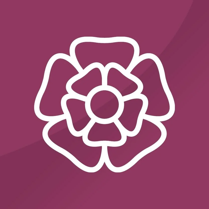White outline of a stylized flower with six petals on a maroon background.