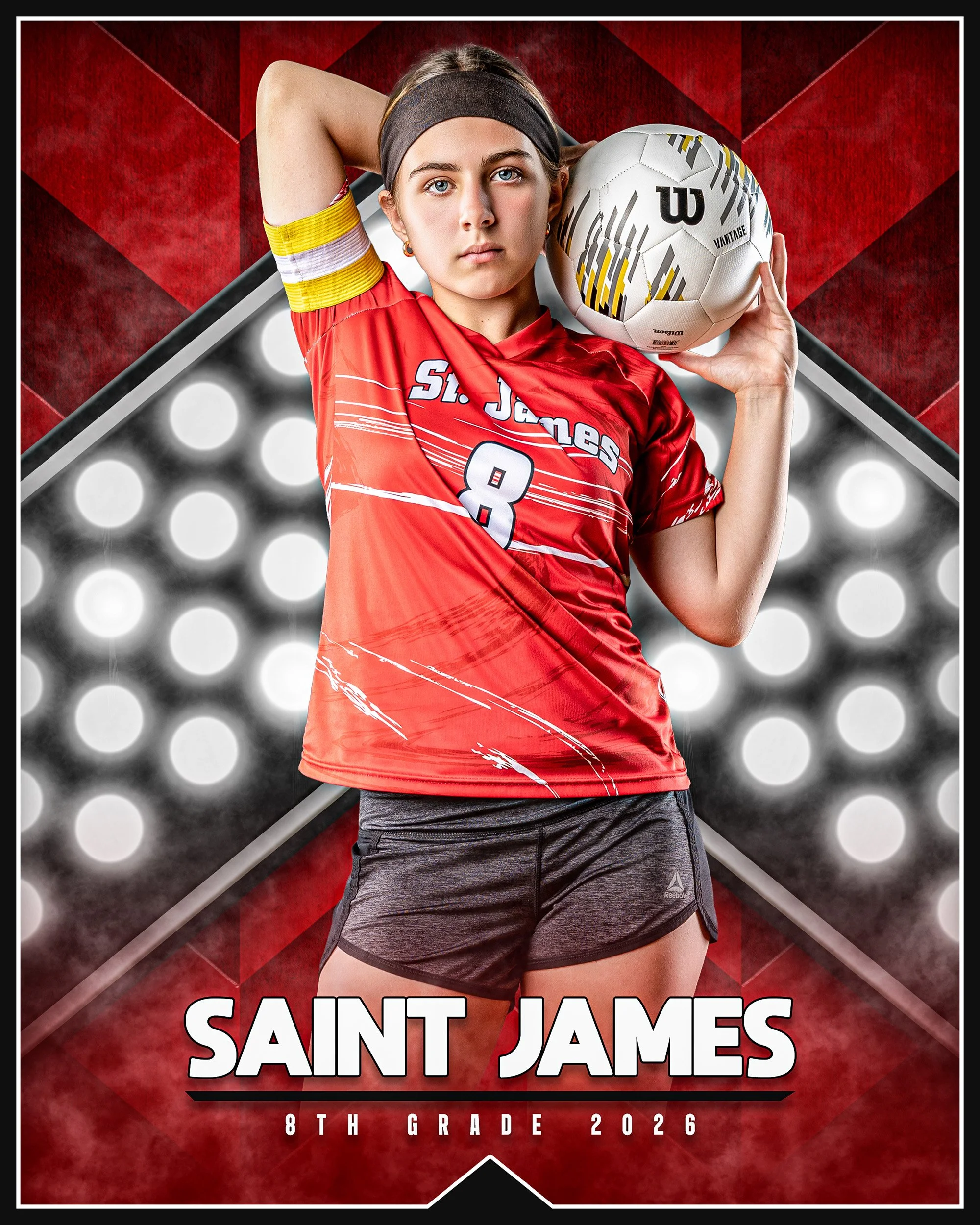 A young female volleyball player in a red Saint James jersey and black shorts holding a volleyball over her shoulder with one arm, standing in front of a sports-themed backdrop.
