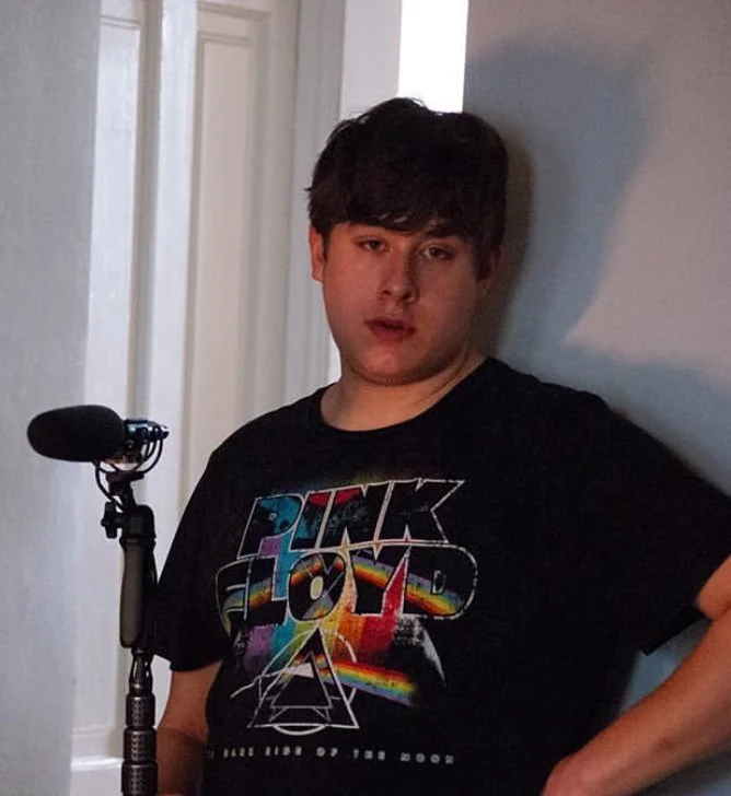 Jack Ludolph holding a boom pole as part of the sound team for "You Not Lightning."