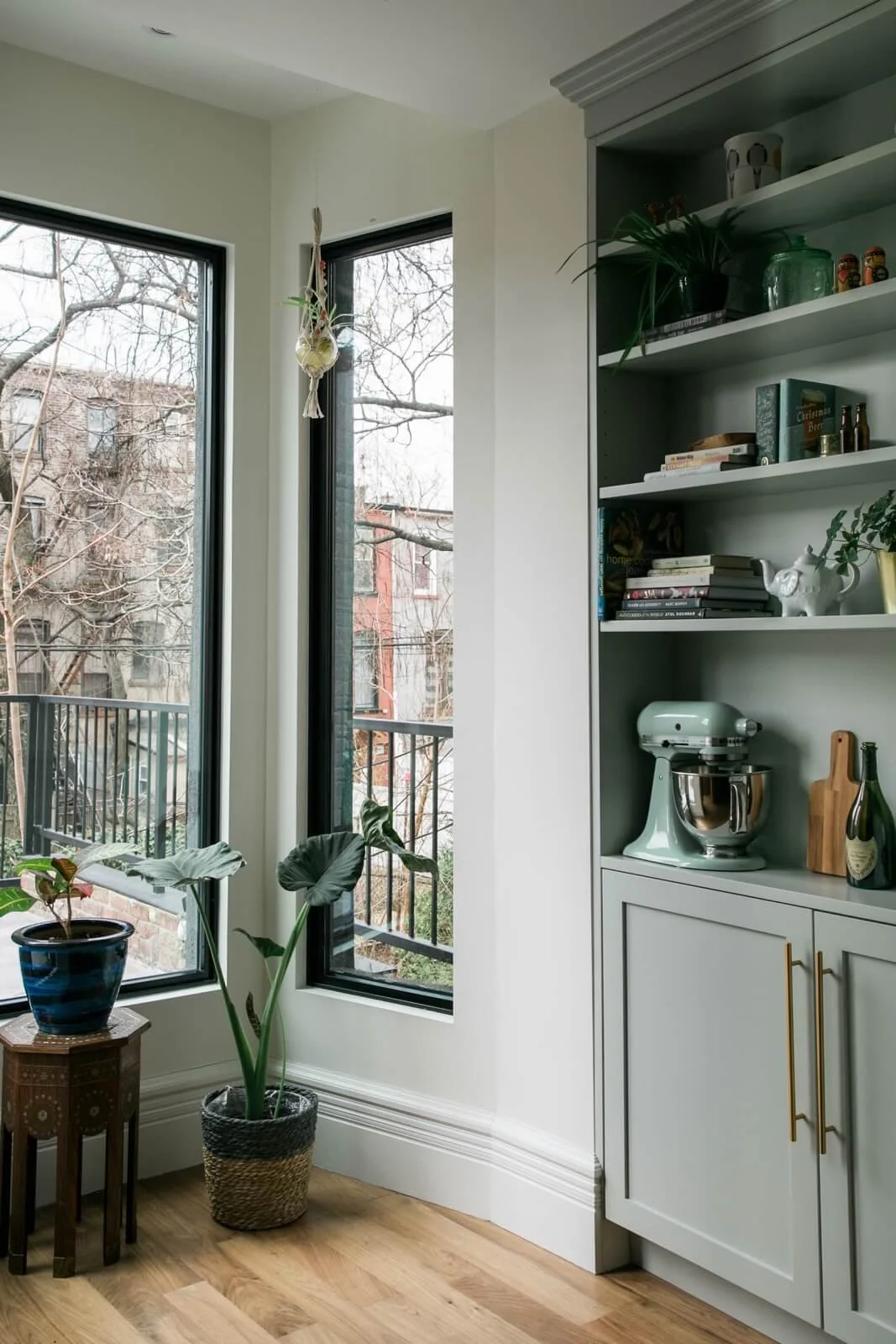 corner of residential kitchen, view of window and shelf