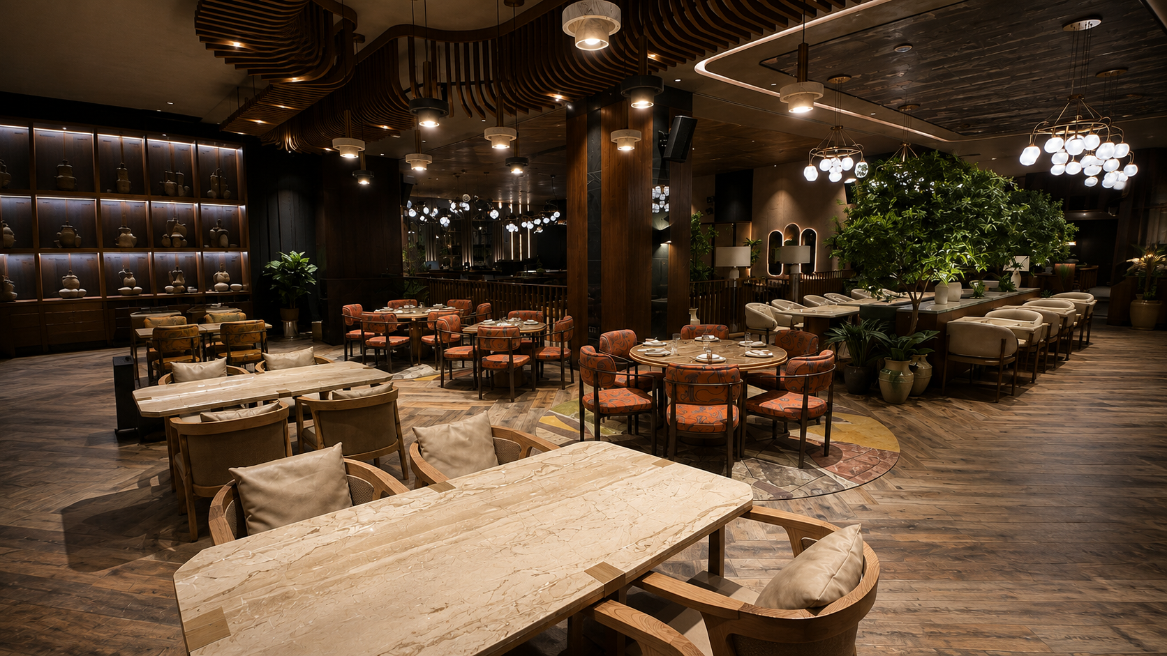 A spacious restaurant with dark wood floors and furniture, decorated with lush green plants, modern hanging light fixtures, and a variety of dining tables set with plates and utensils.