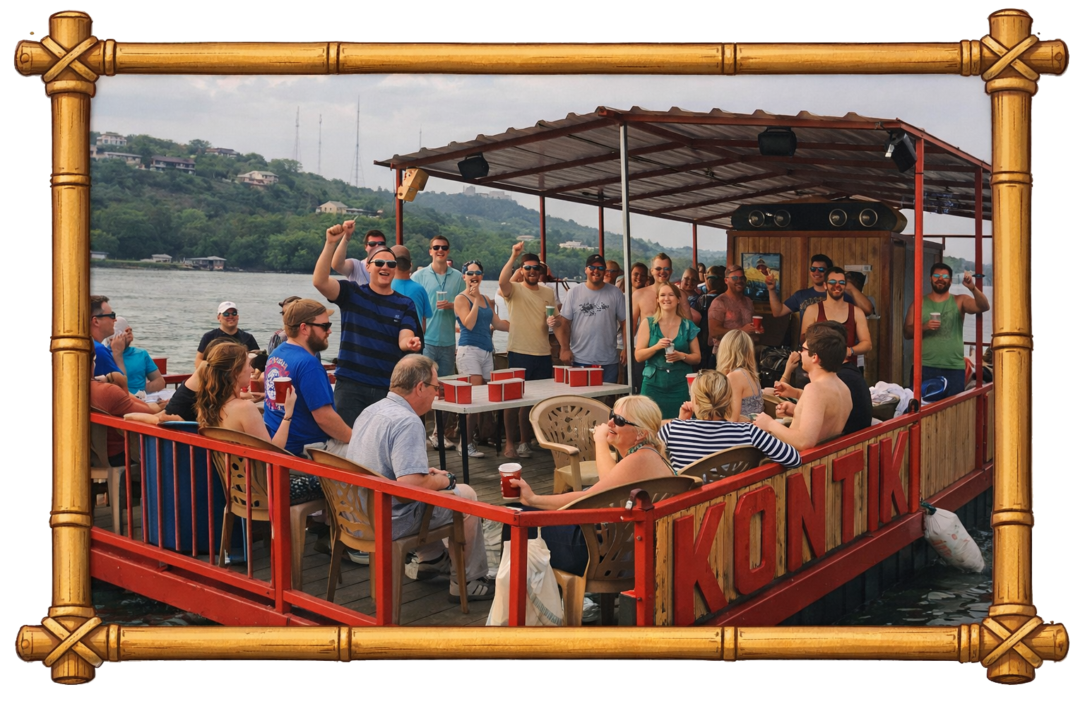 People enjoying a boat party on a river, with some standing and holding drinks, others sitting at tables and chatting, on a wooden boat with a partially covered roof, surrounded by scenic green hills in the background.
