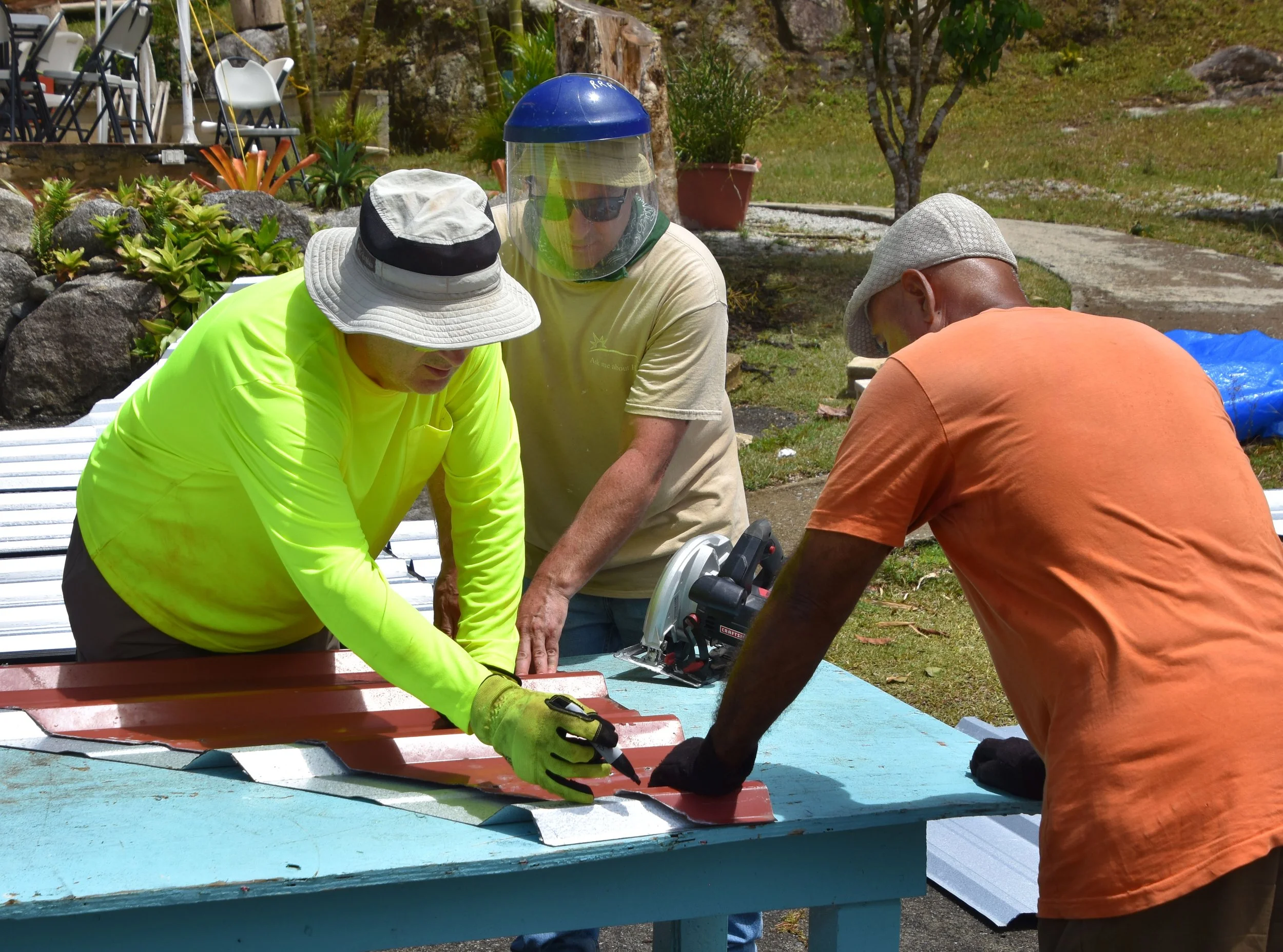 Volunteers on a mission trip in Puerto Rico repairing weather-damaged dwellings.