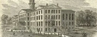Historical black-and-white illustration of a large, old brick building with multiple stories and a clock tower in the background.