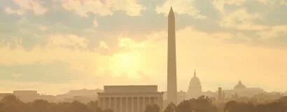 Sunset over Washington, D.C. with the Washington Monument and U.S. Capitol building in view.