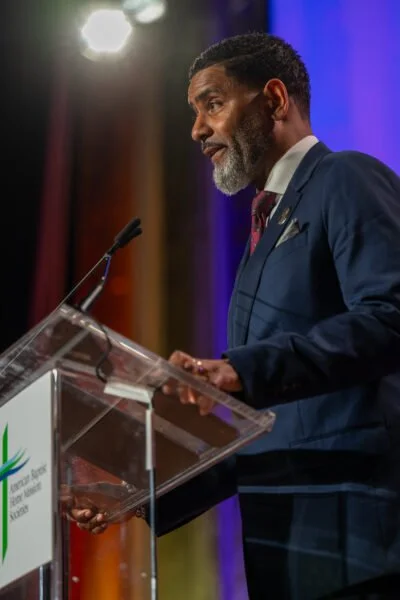Photo of Rev. Dr. Otis Moss III delivering plenary address at Space for Grace 2026.